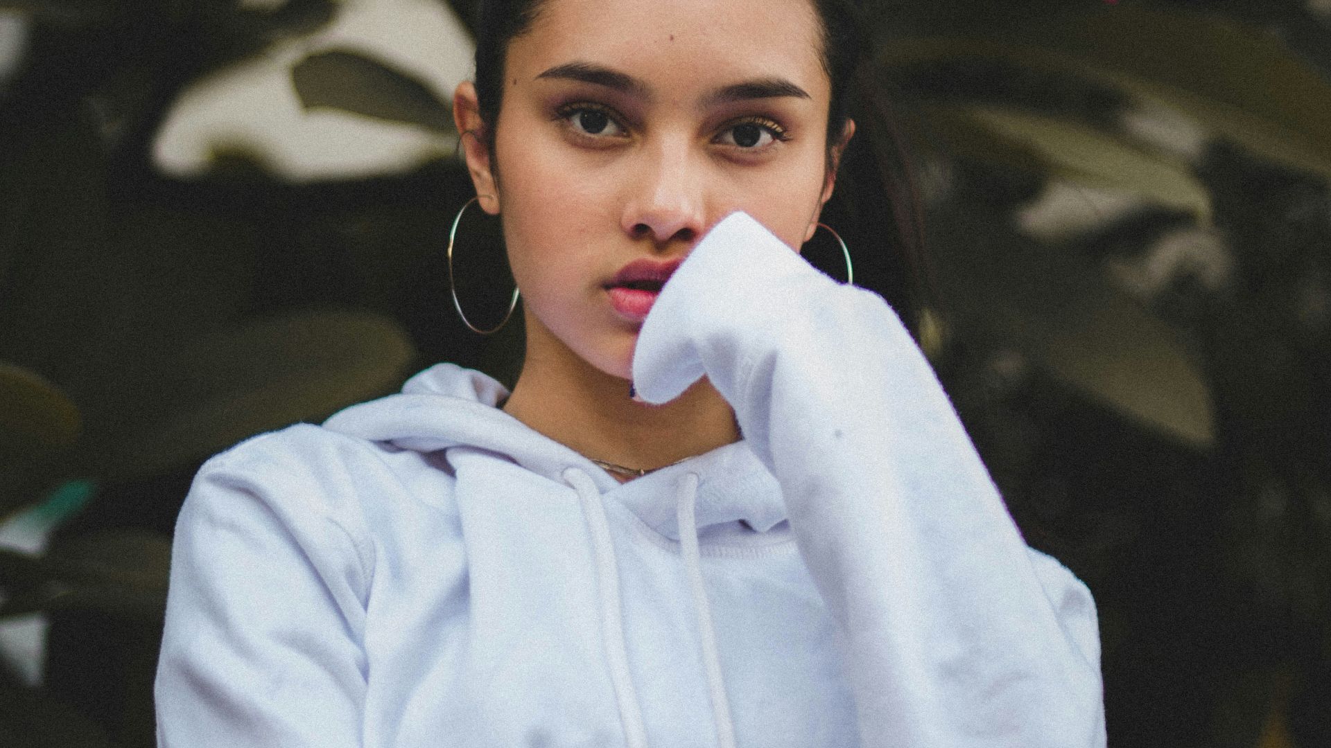 portrait photography of woman in white pullover hoodie