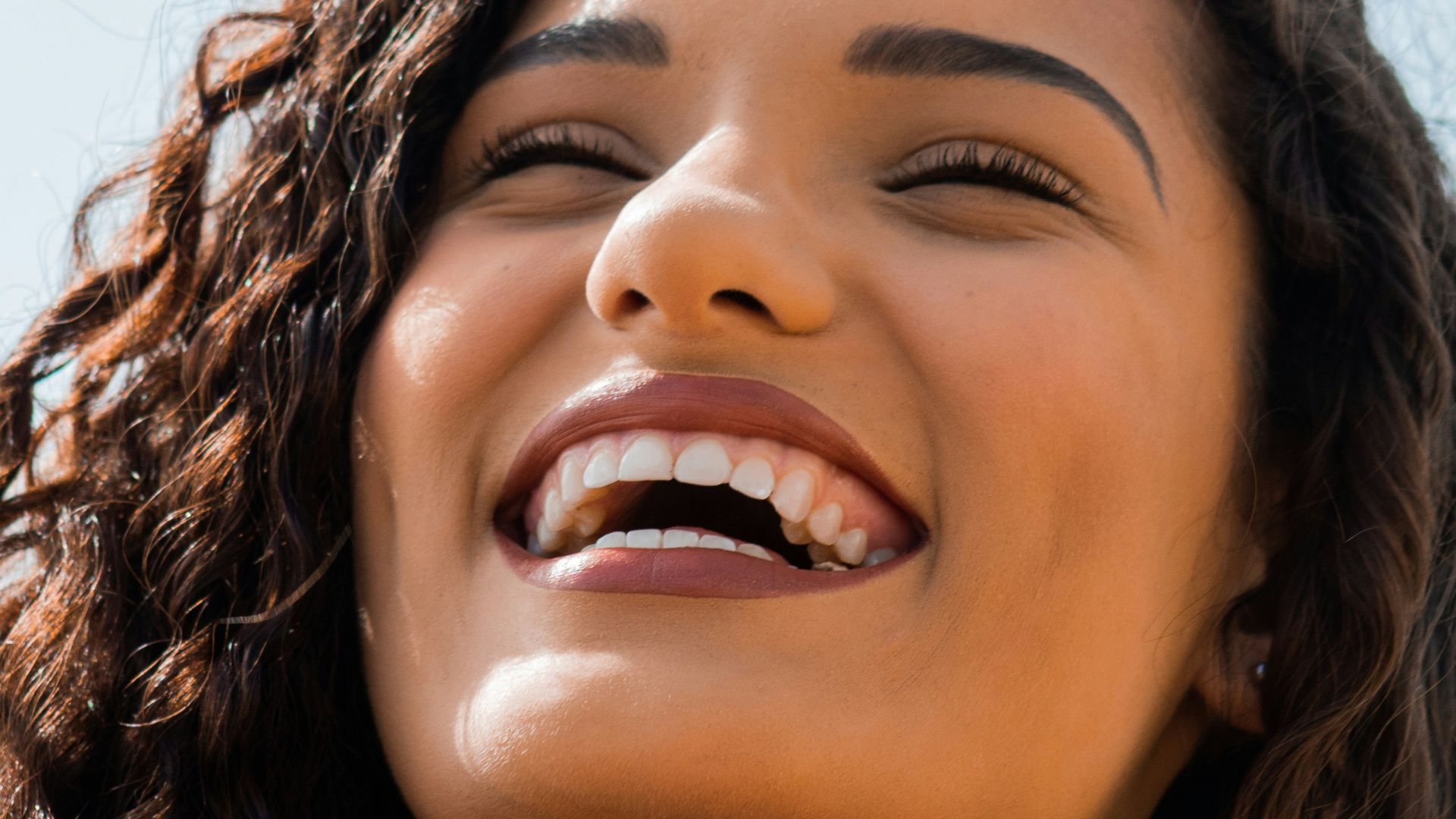 woman with brown hair smiling