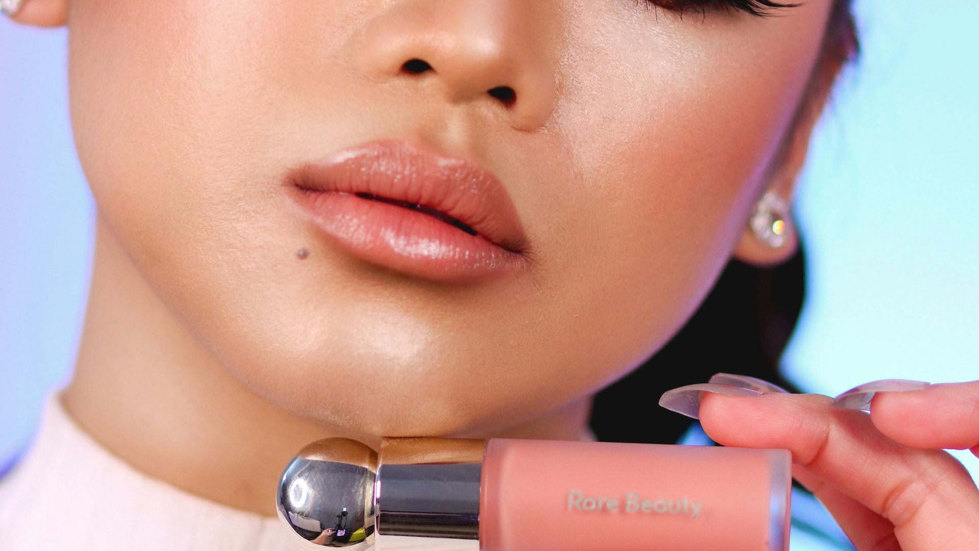 woman with pink lipstick and white shirt