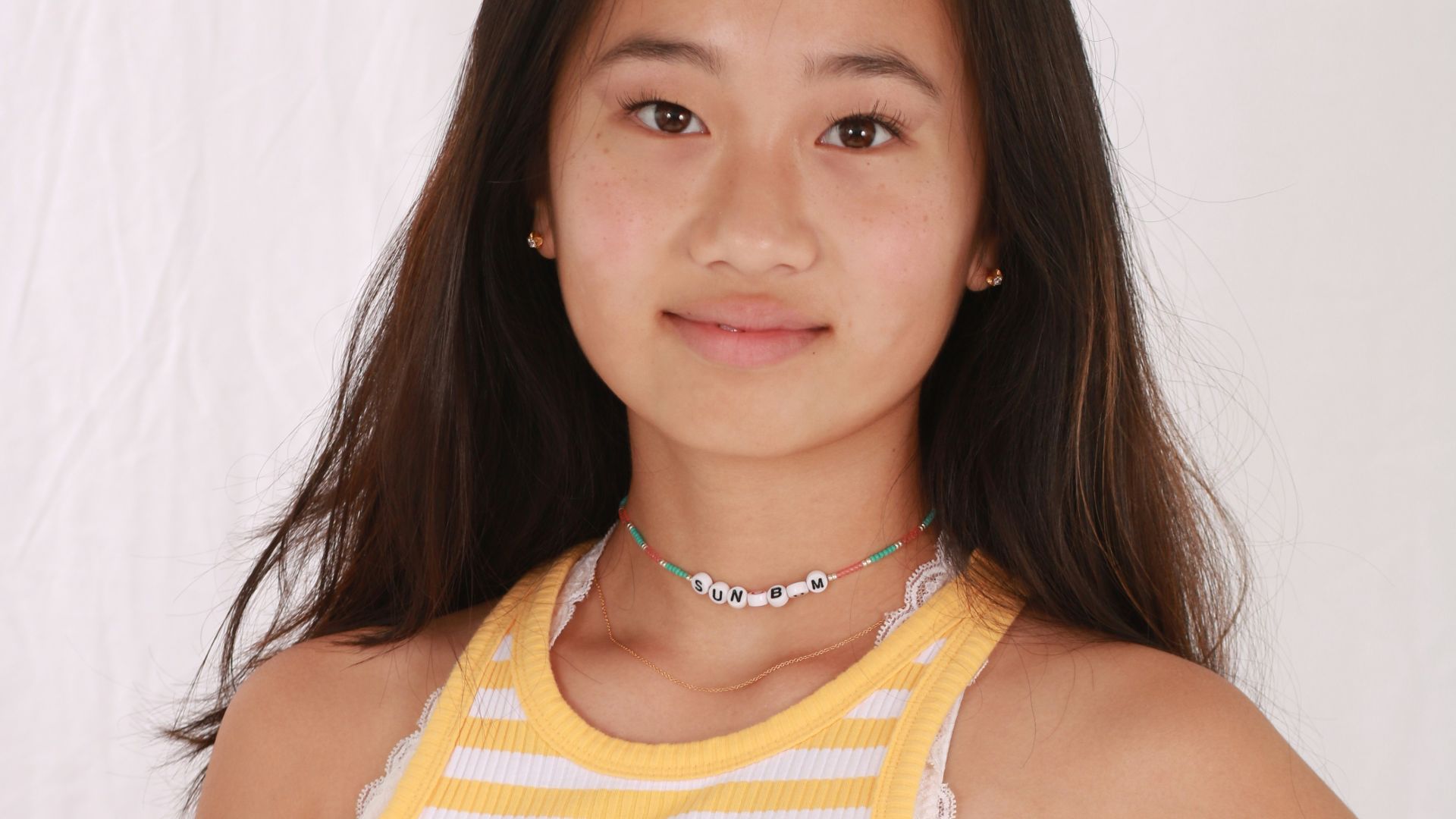 woman in yellow and white stripe tank top