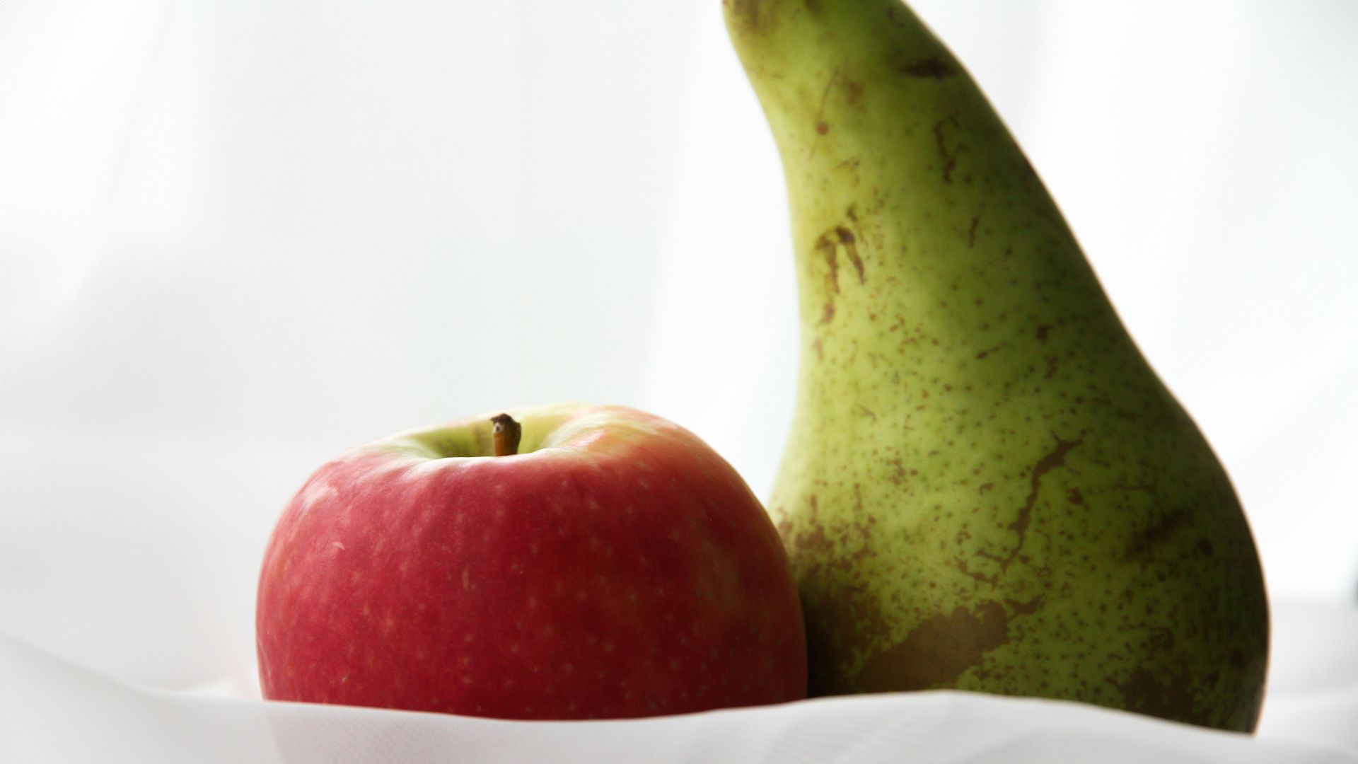 red apple fruit on white paper