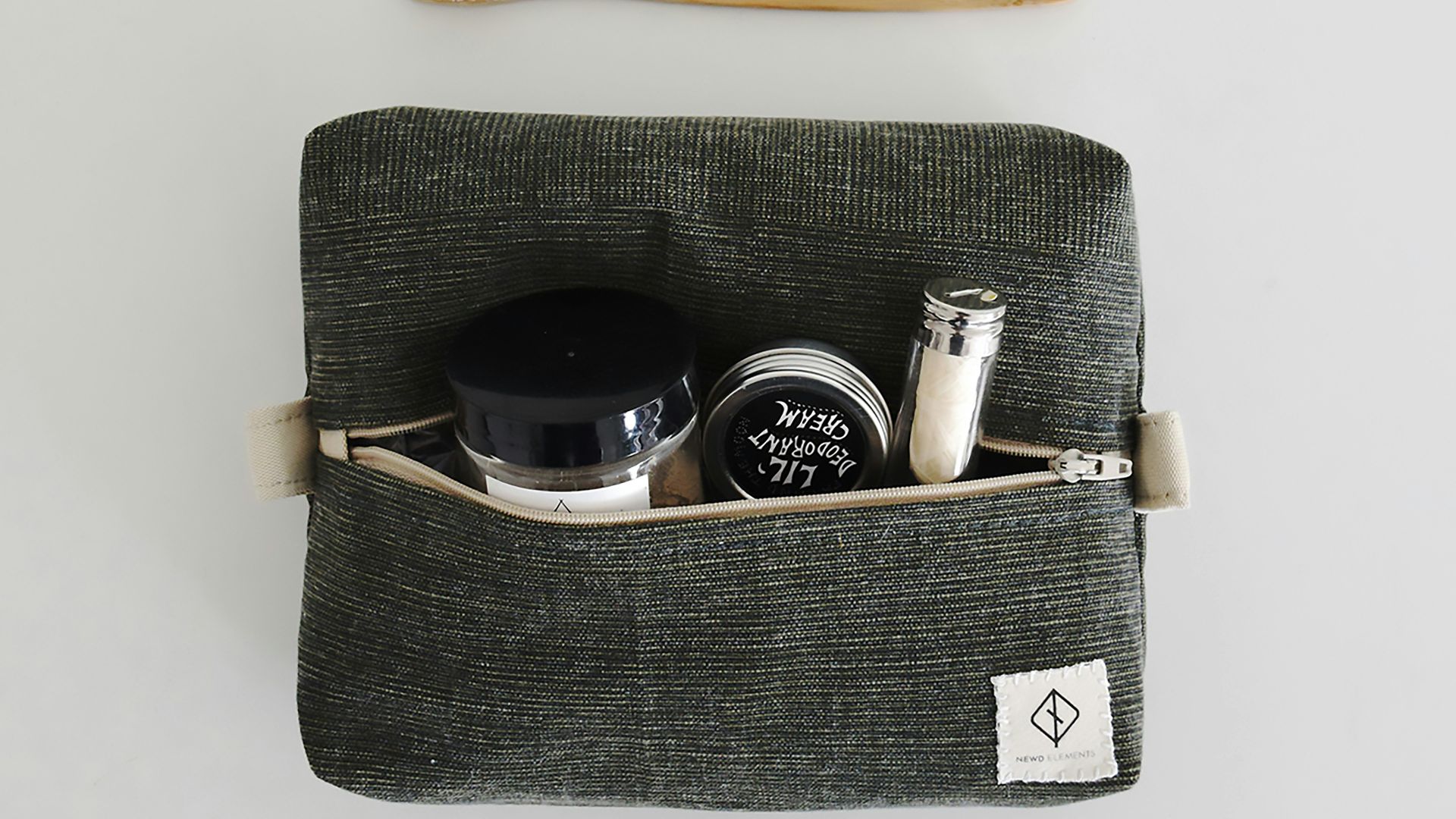 Toiletries and personal care items laid out flat.