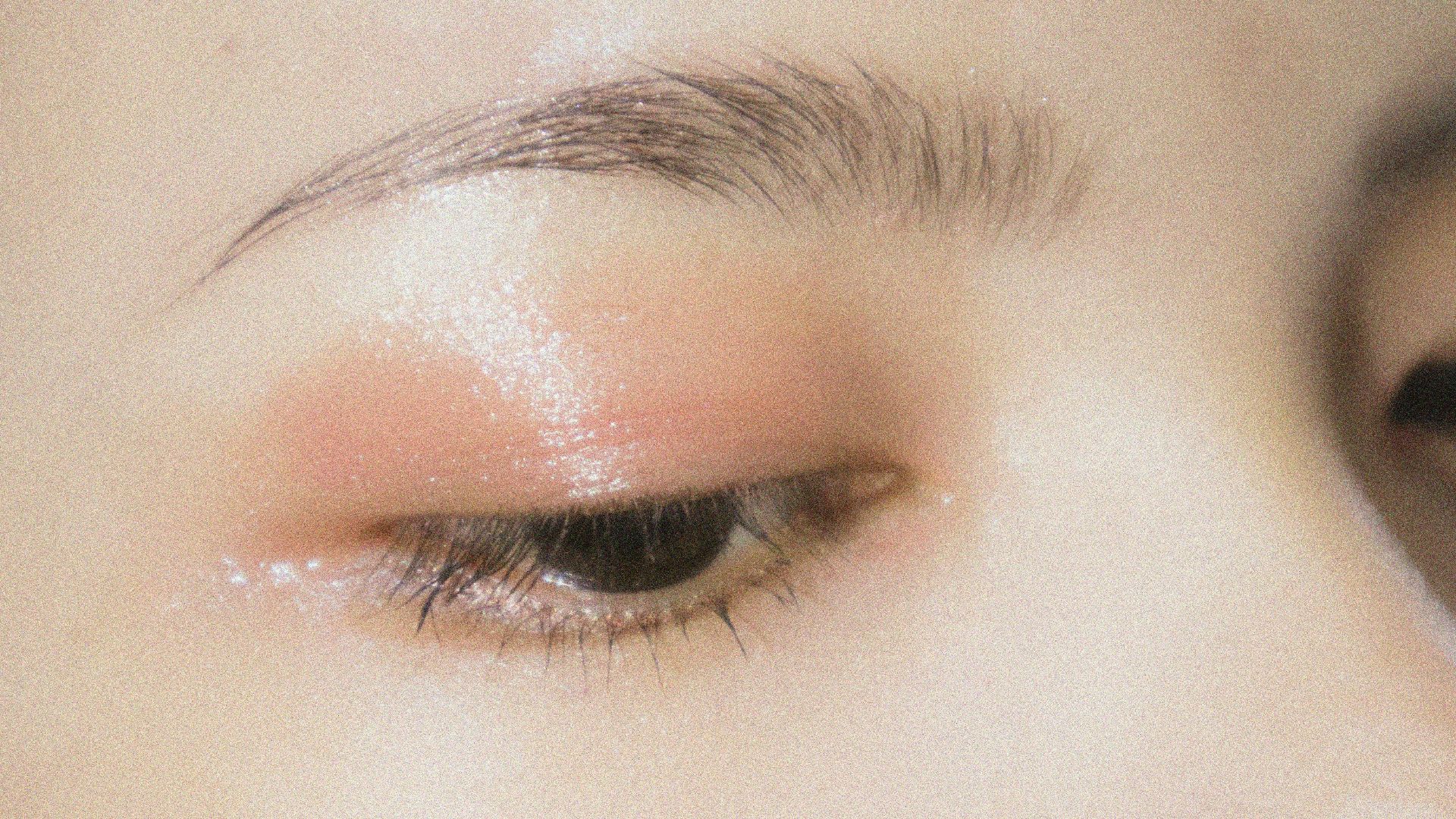 a close up of a woman's eye with makeup