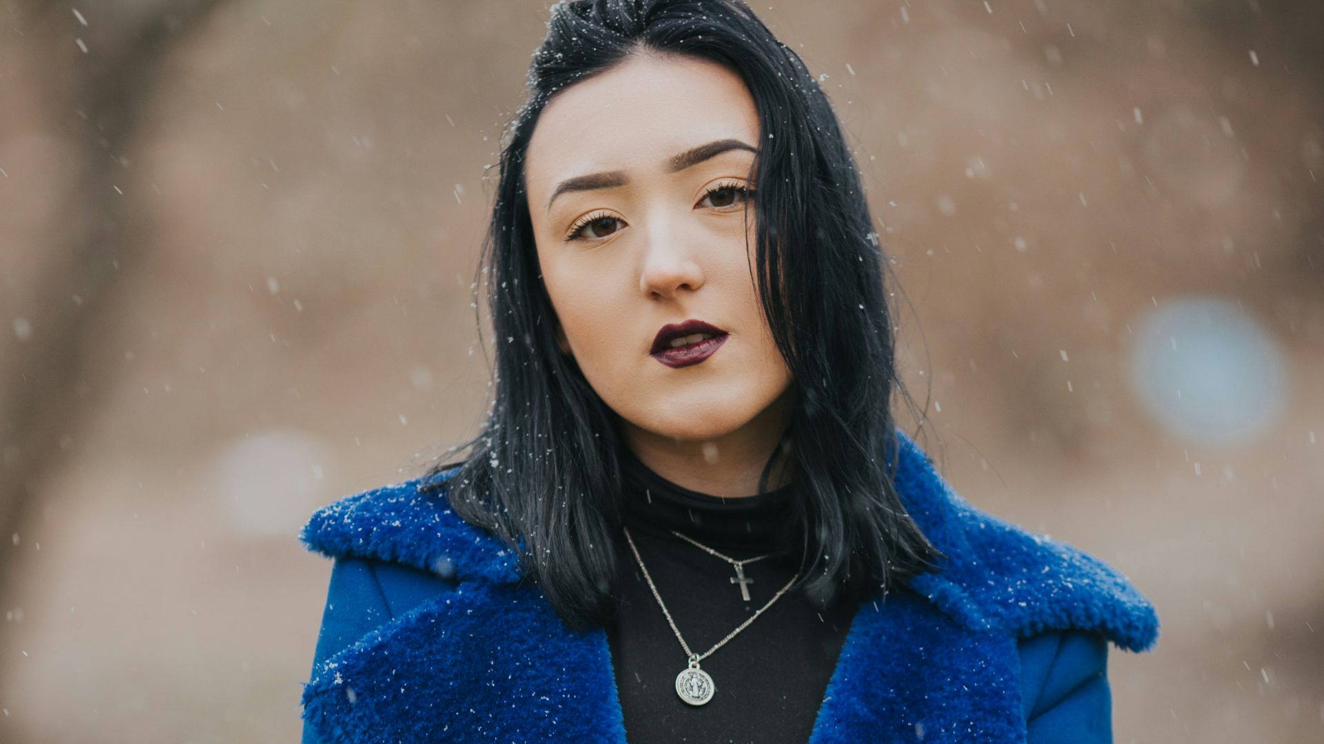 woman wearing blue coat