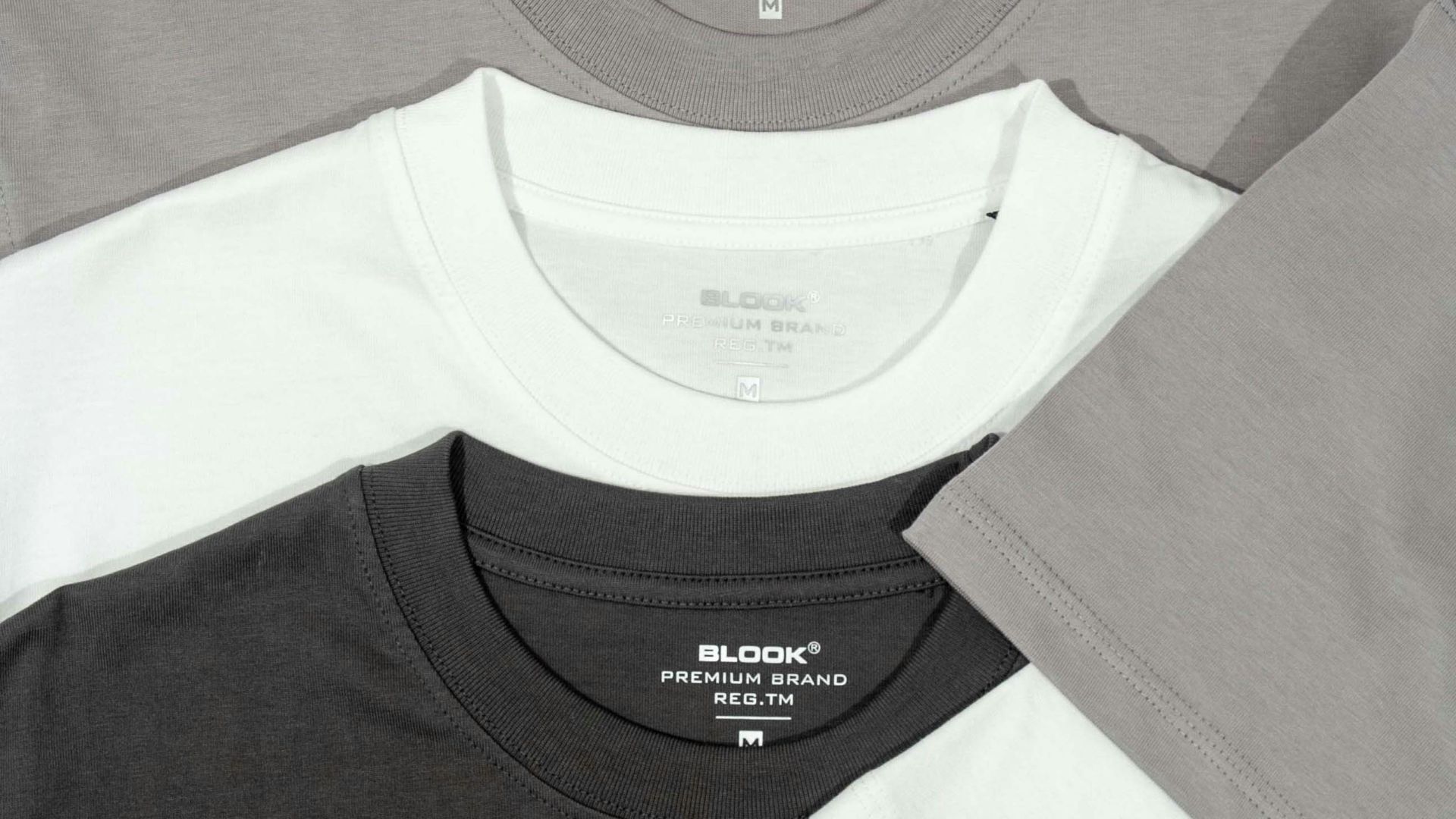a group of three different colored t - shirts