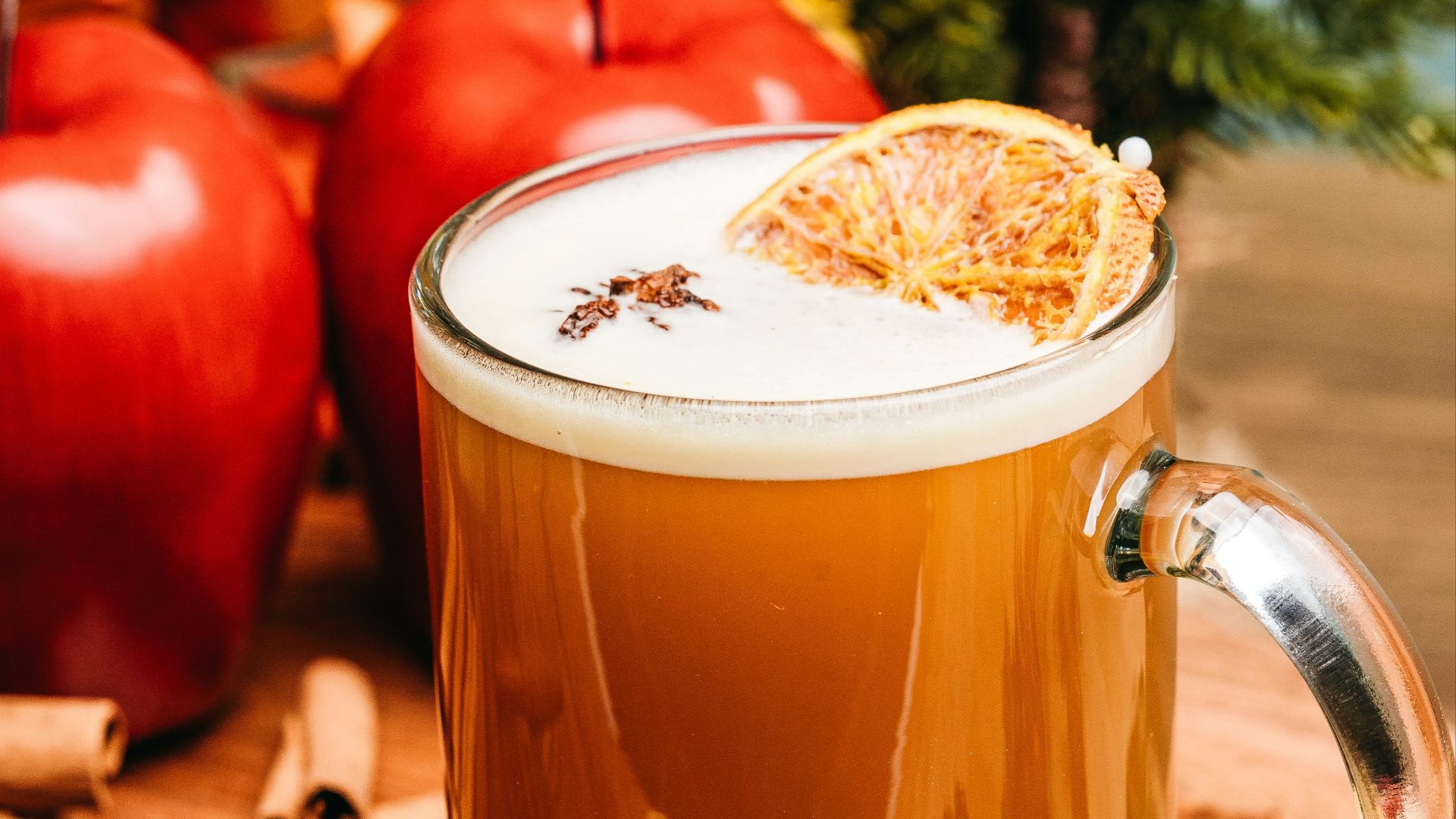 a glass of tea with lemons and a slice of lemon