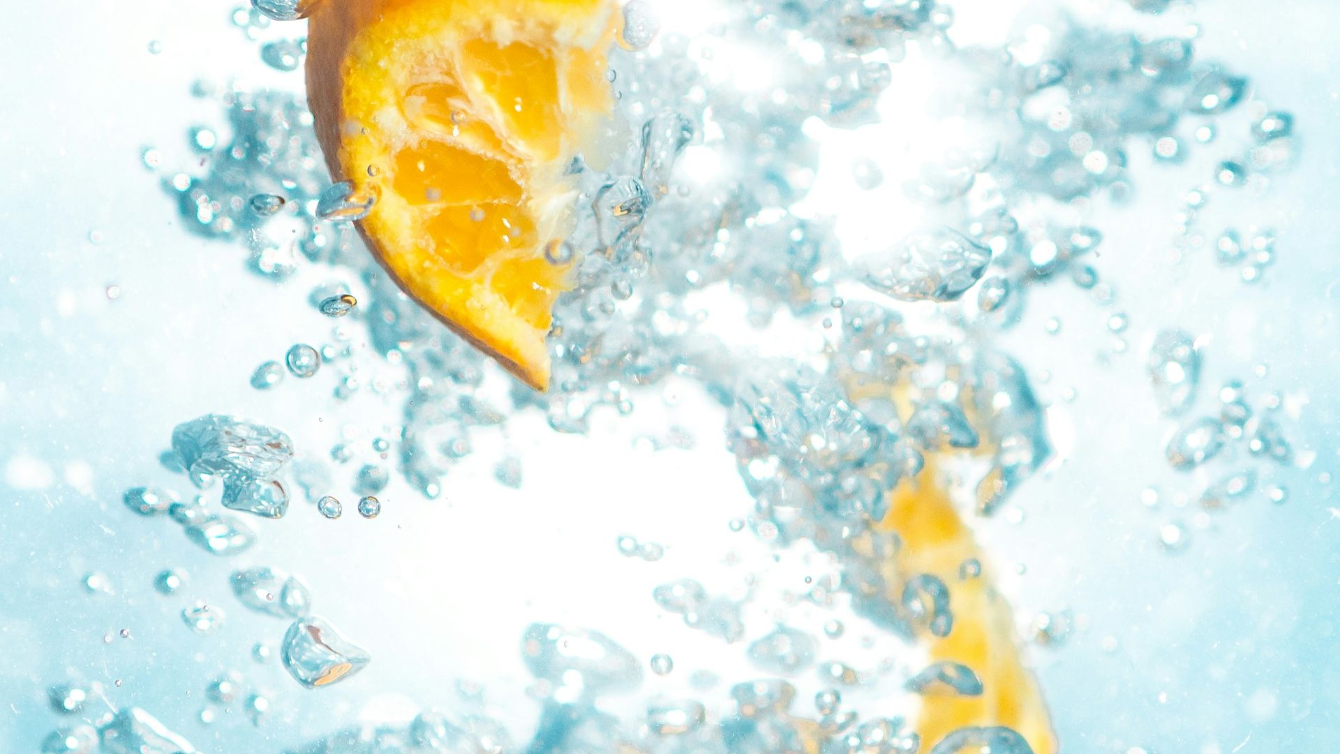 sliced orange fruits underwater