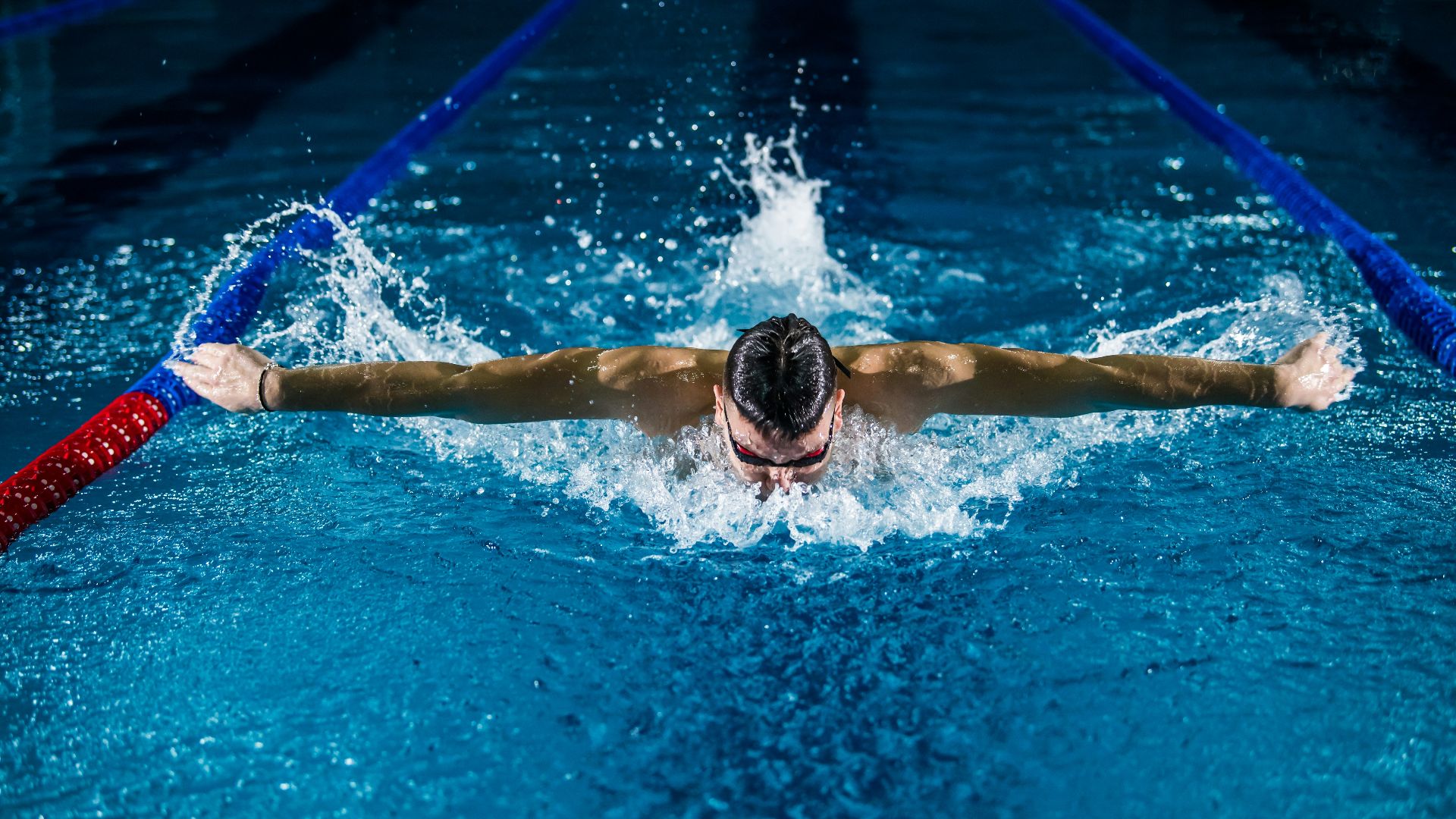man doing butterfly stroke