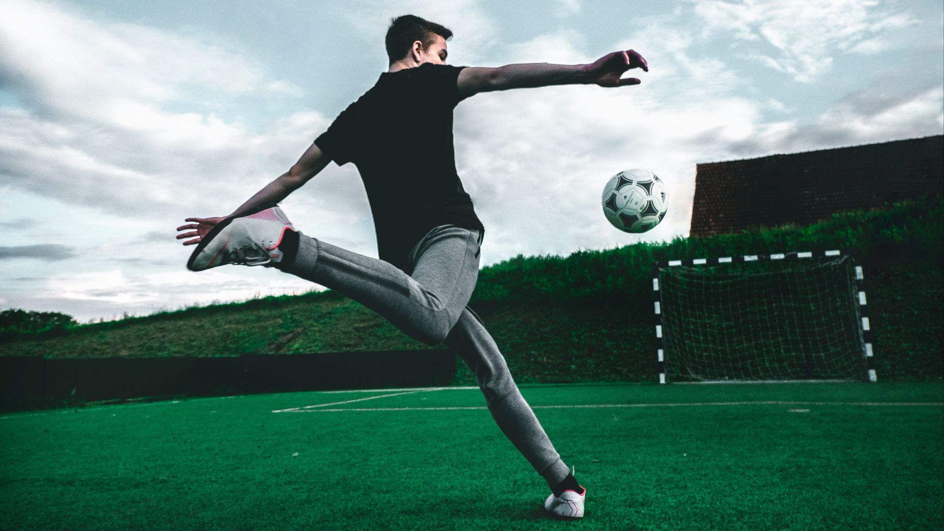 man playing soccer during daytime