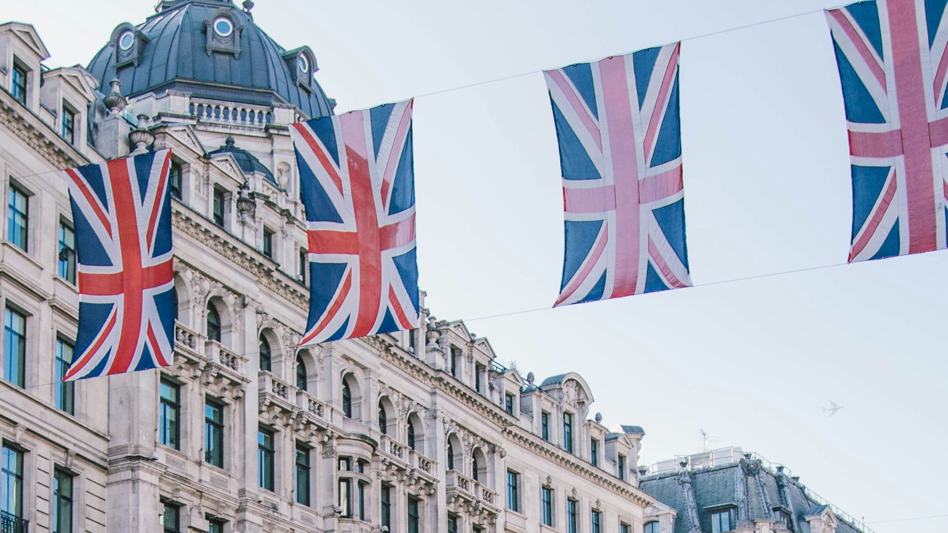 photo of car and bus near castle