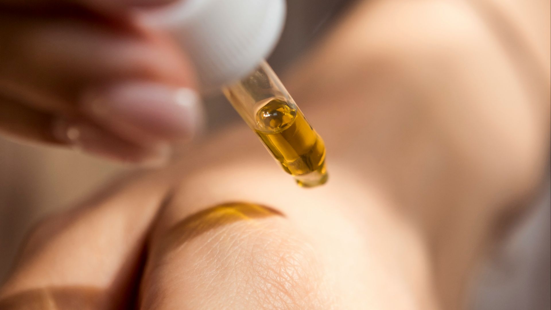 person holding dropper