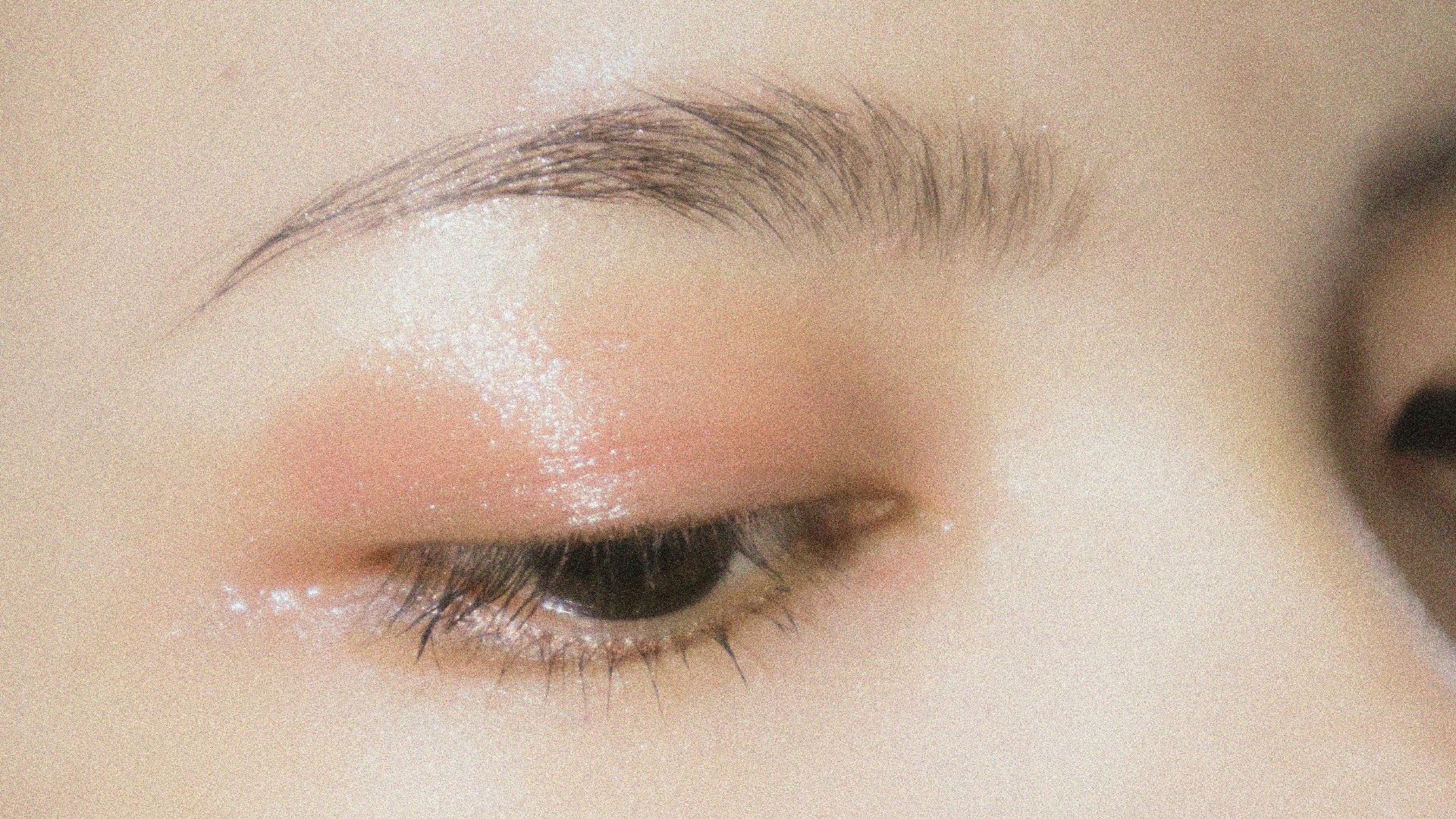 a close up of a woman's eye with makeup