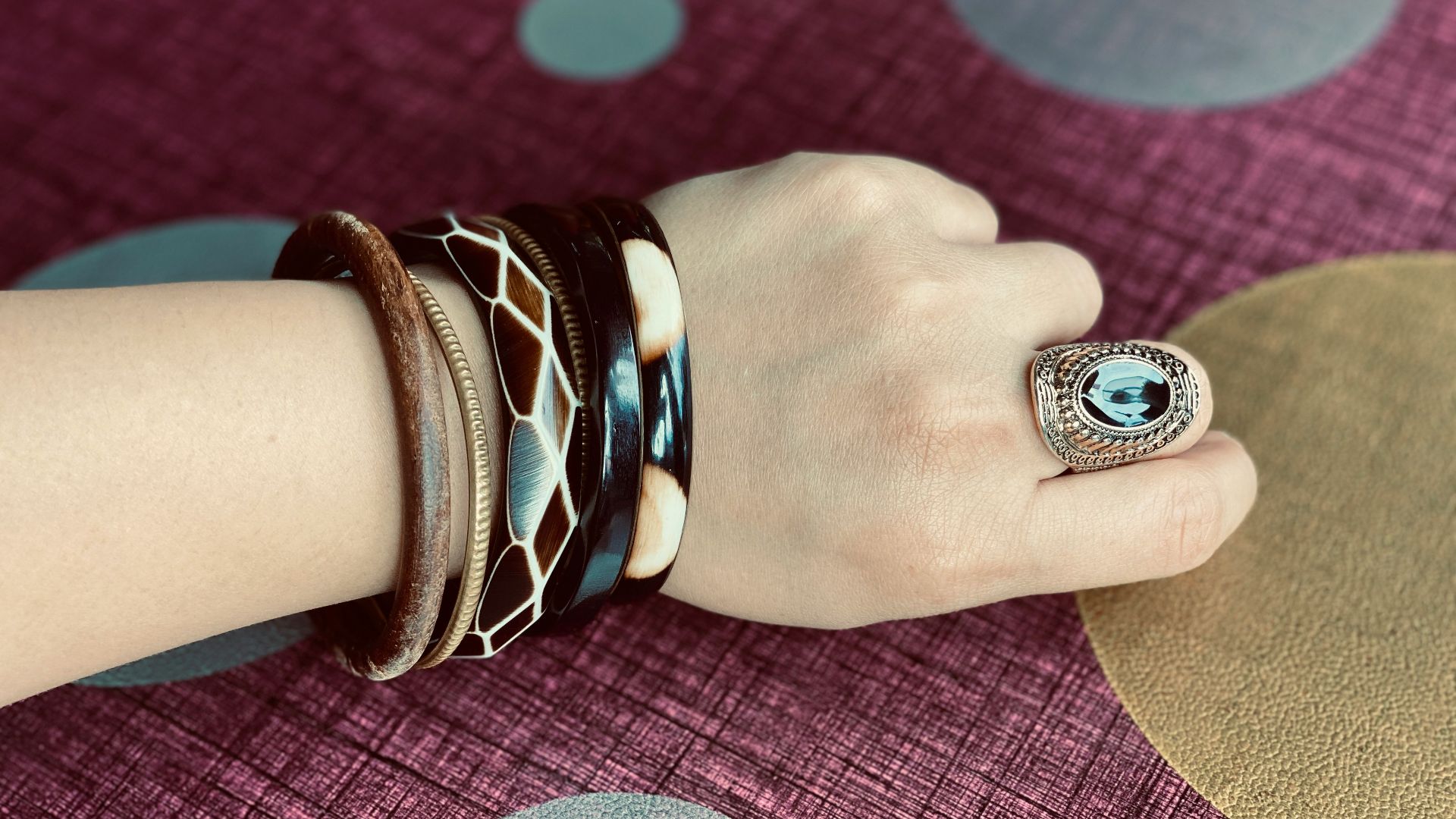 person wearing silver and black ring