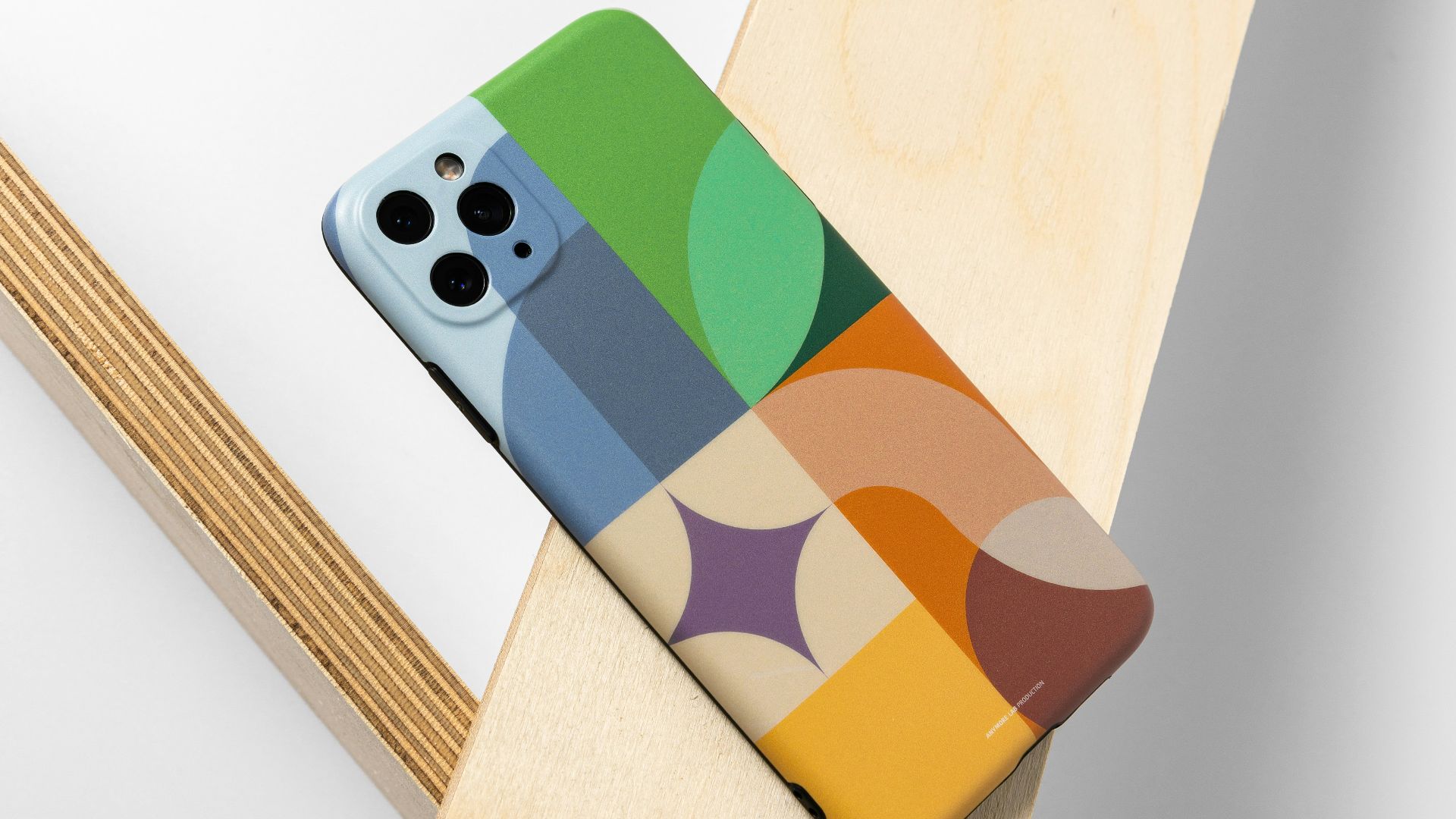 a phone case sitting on top of a wooden table