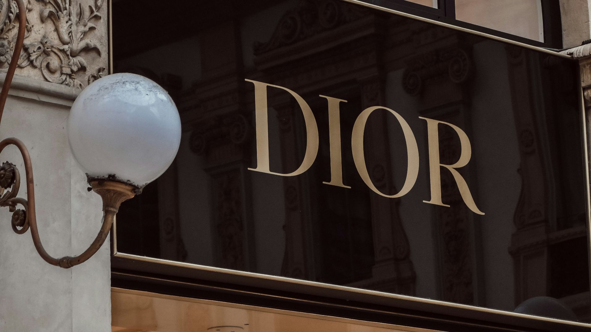 a large glass door with a large white ball in front of it