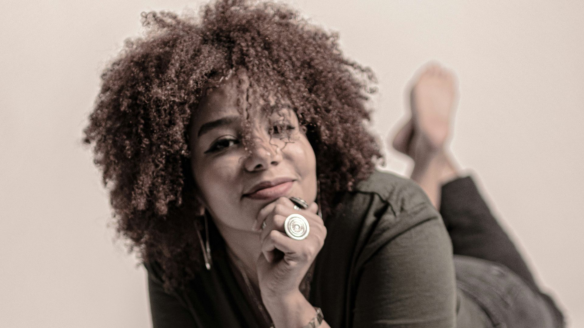 a woman with curly hair