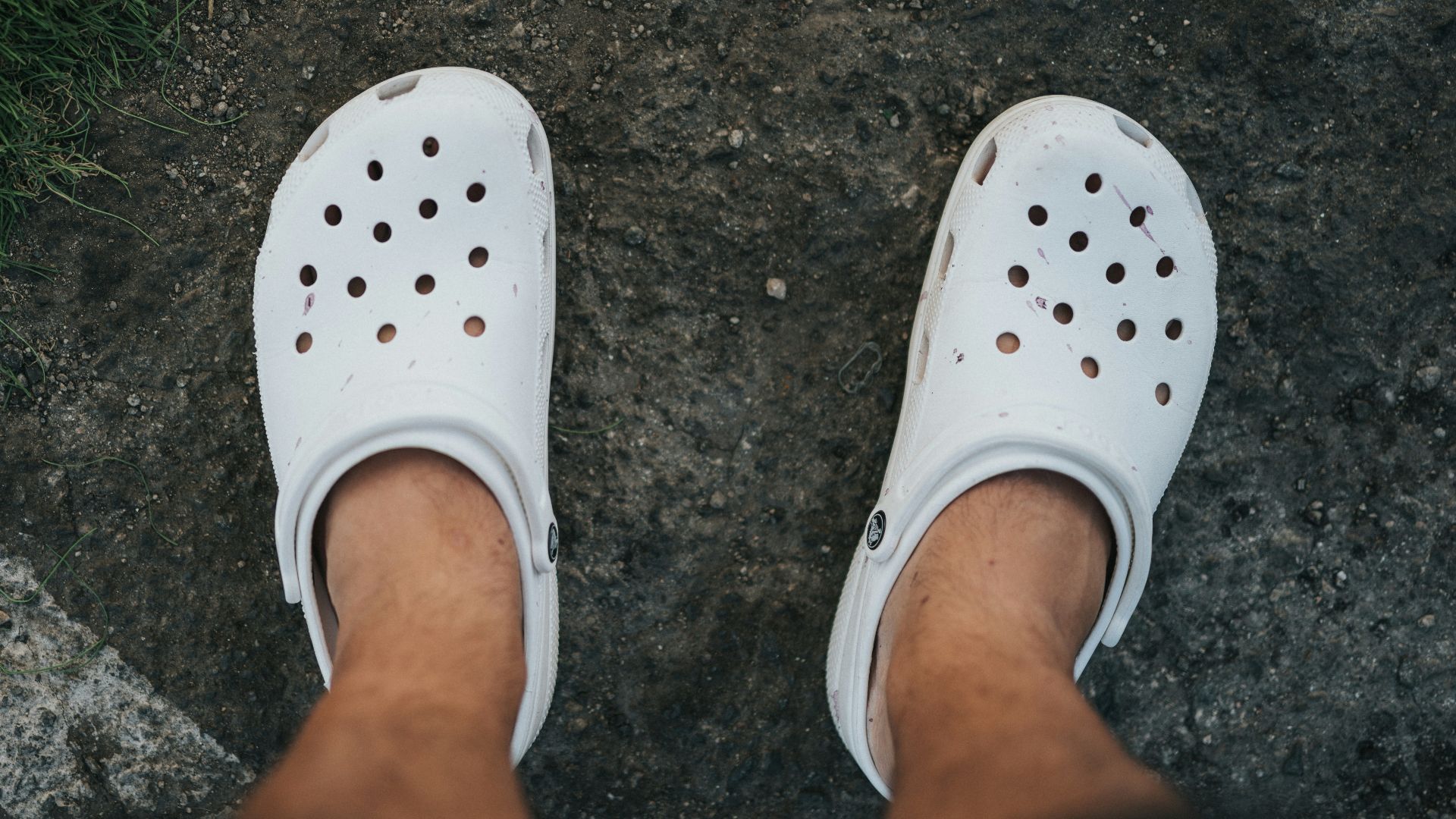 person wearing white rubber clog
