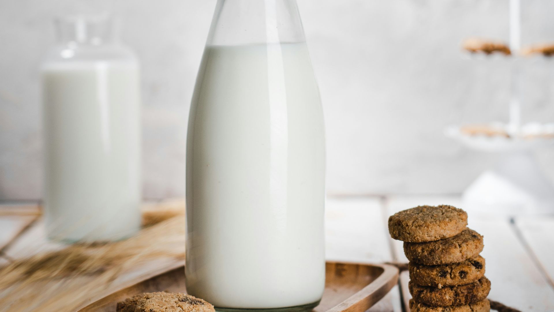 a bottle of milk and some cookies on a table