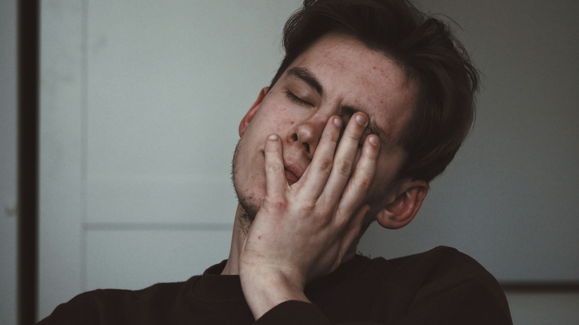 man wearing black crew-neck top