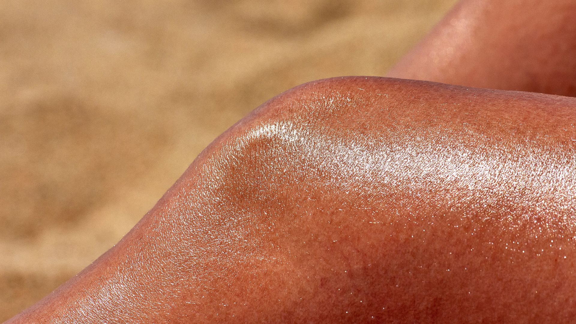 a close up of a person's tanning legs