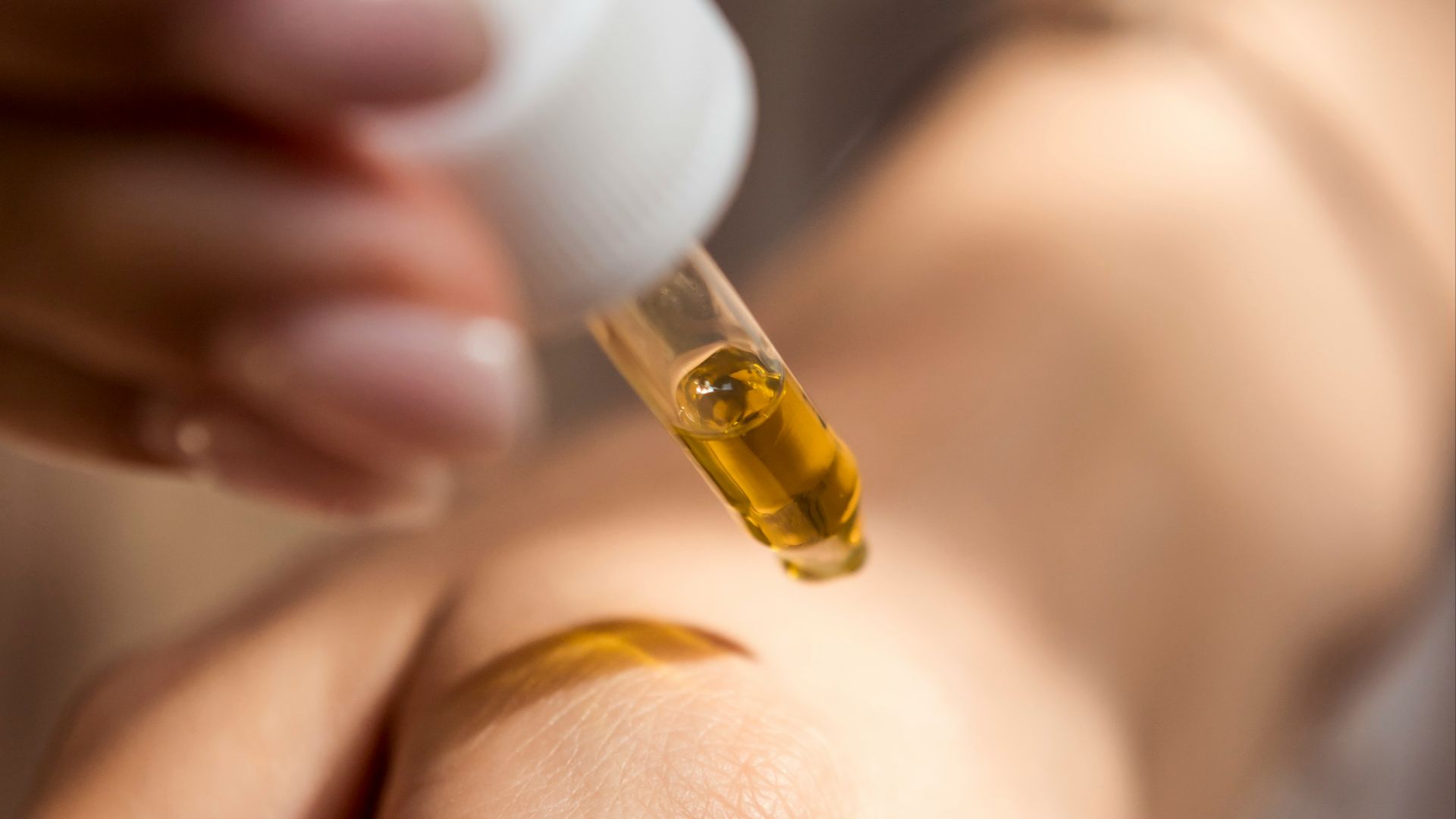 person holding dropper