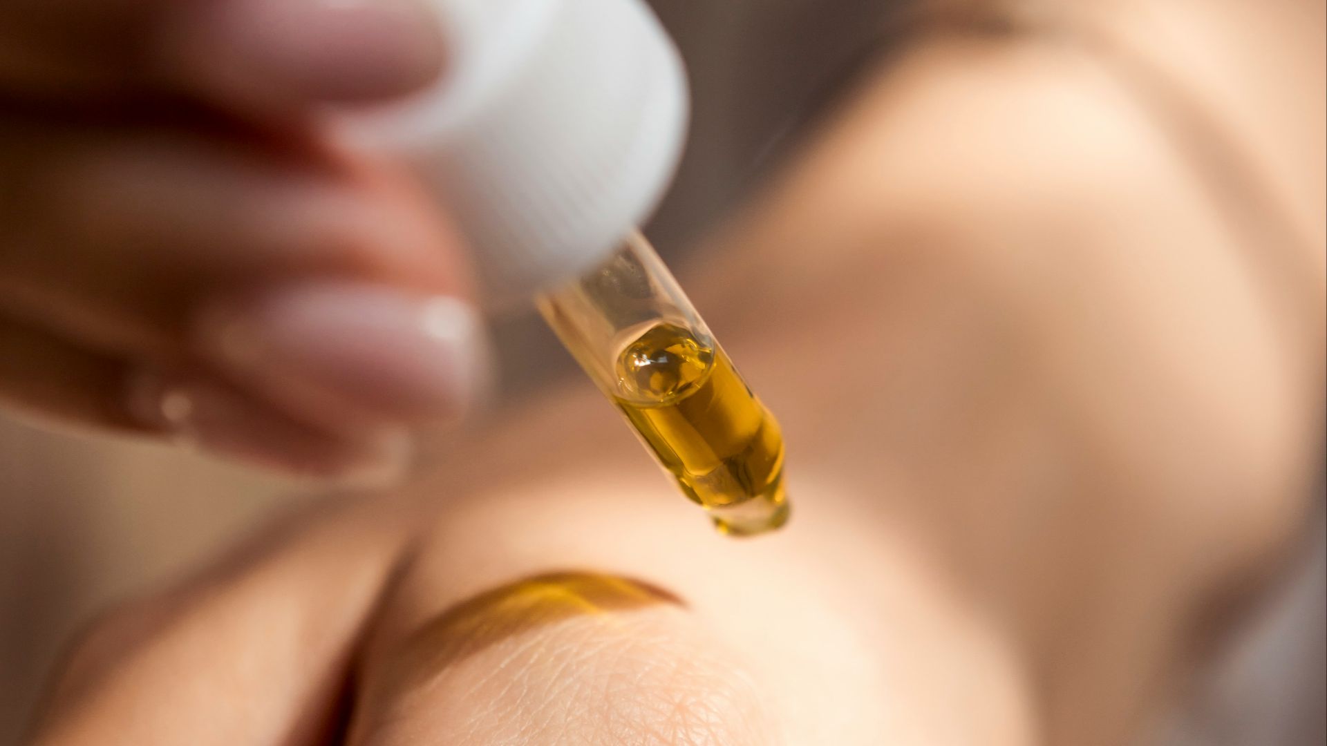 person holding dropper