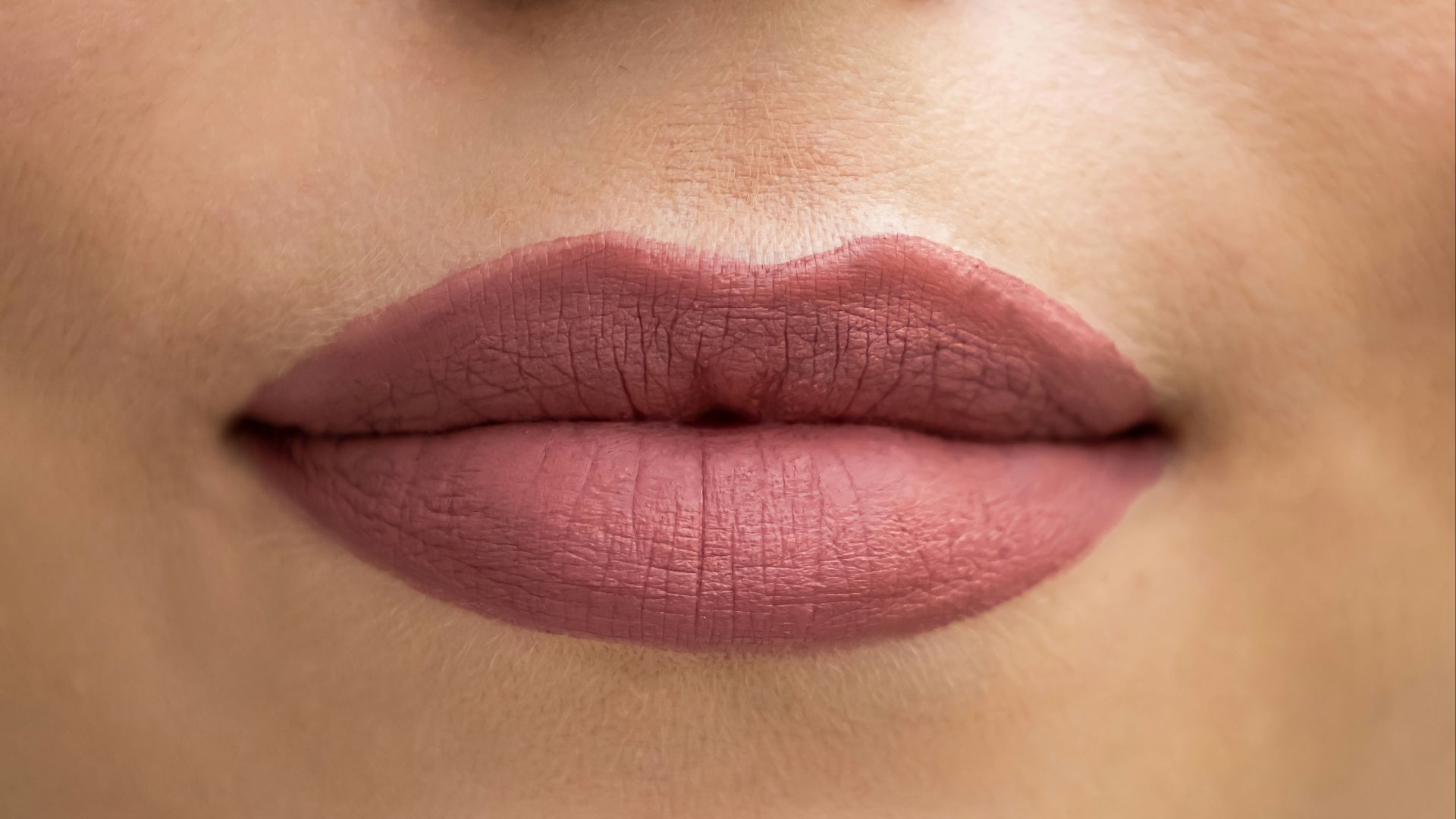 a close up of a woman's lips and nose