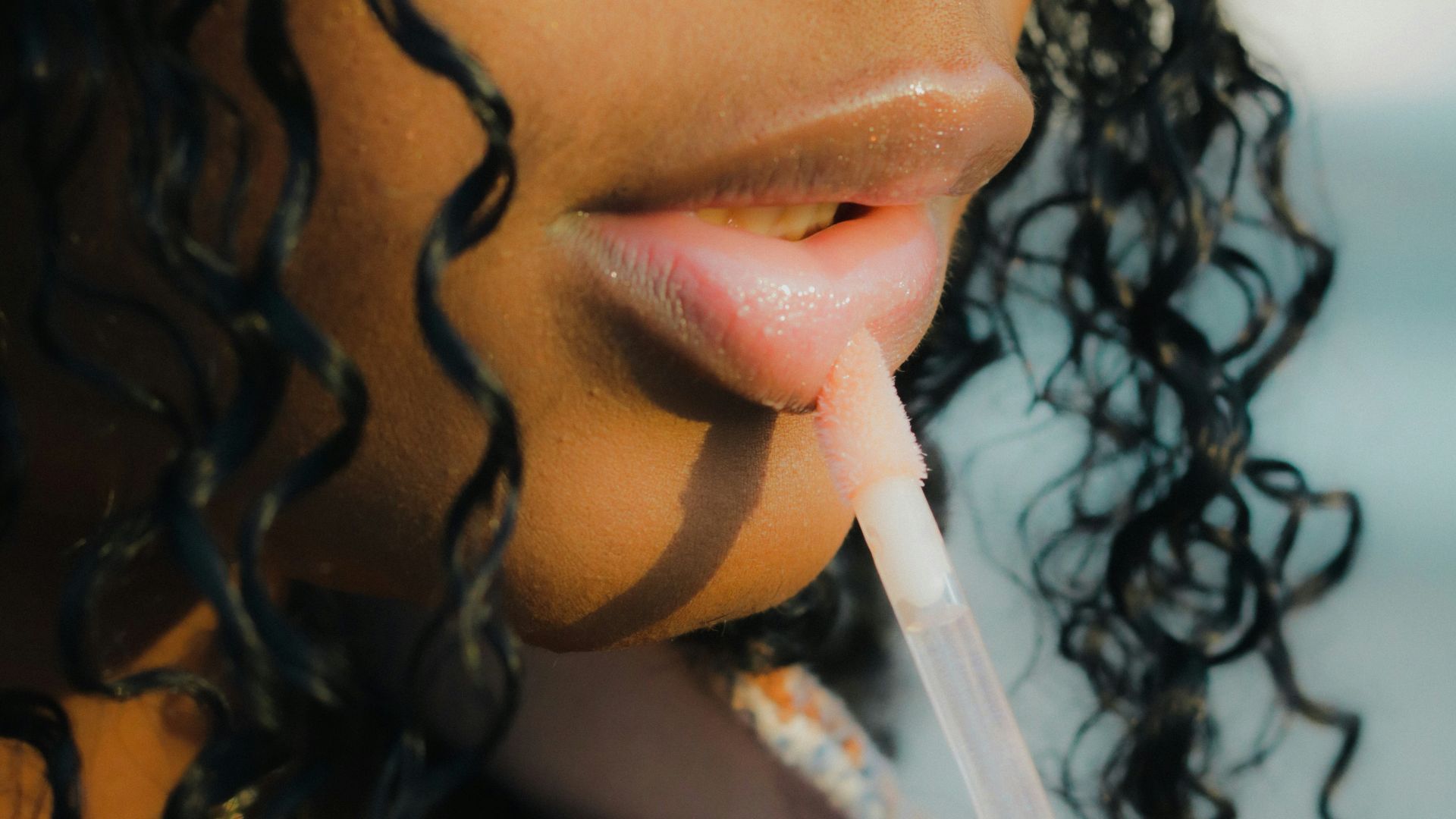 a close up of a person holding a toothbrush