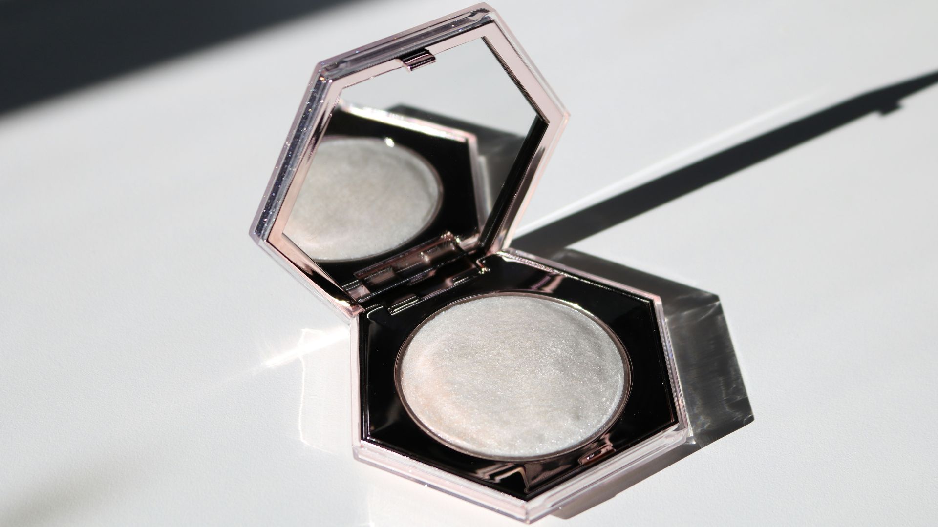 black eyeshadow palette on white table