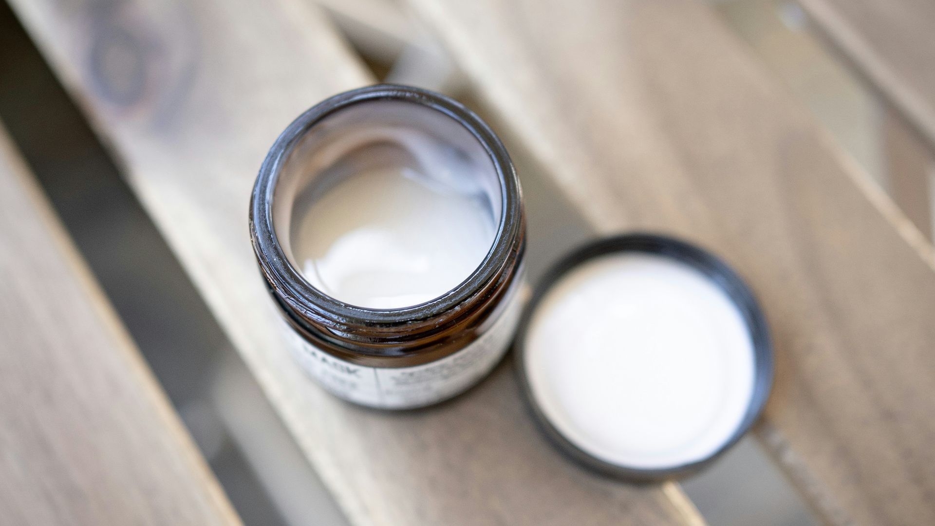 silver ring on brown wooden table