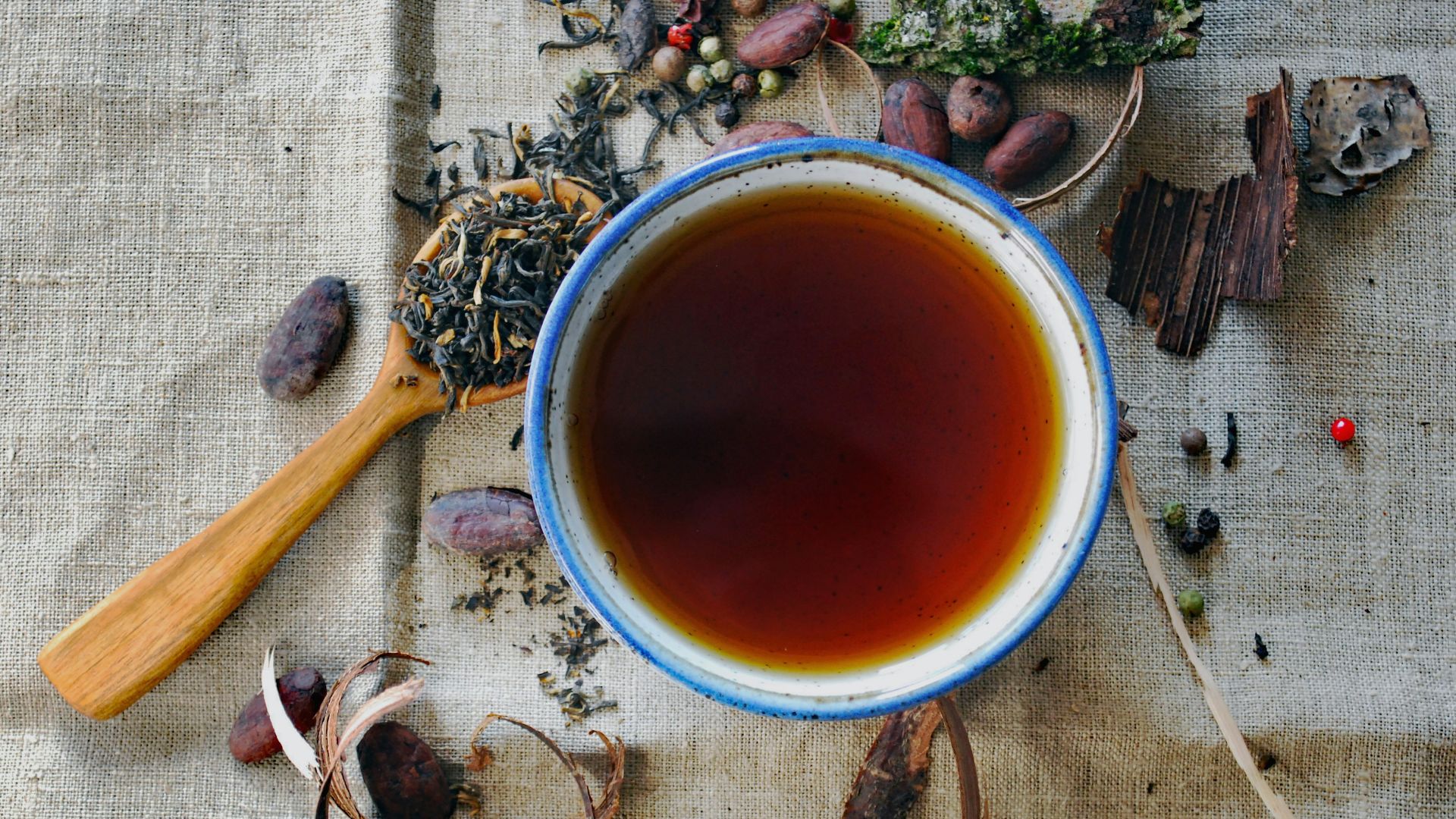 white and brown ceramic mug
