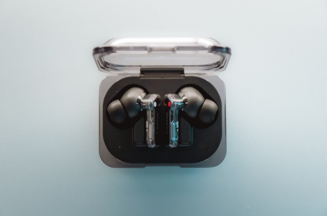 A pair of ear buds sitting in a case