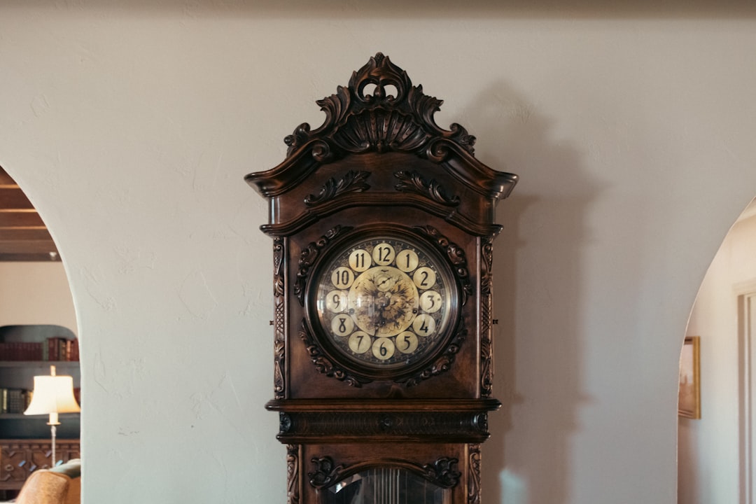 A grandfather clock sitting on top of a table