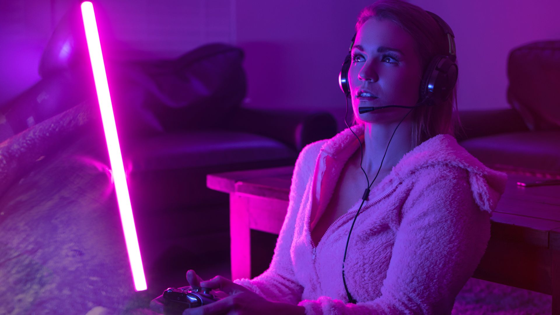 woman in white robe sitting on couch