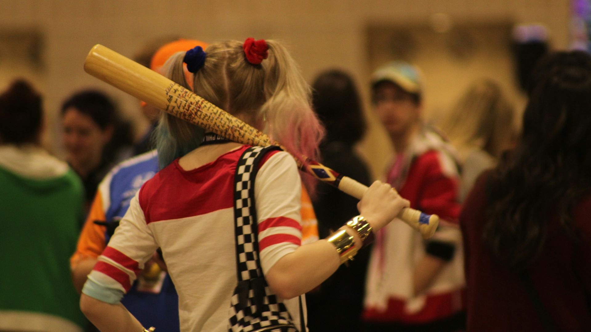 a woman with a baseball bat in her hand