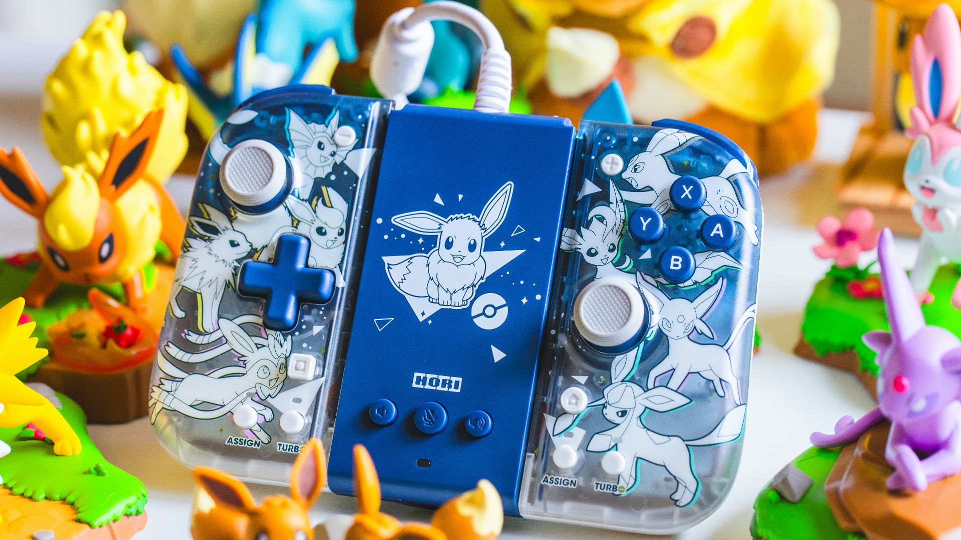 a couple of nintendo wii game controllers sitting on top of a table