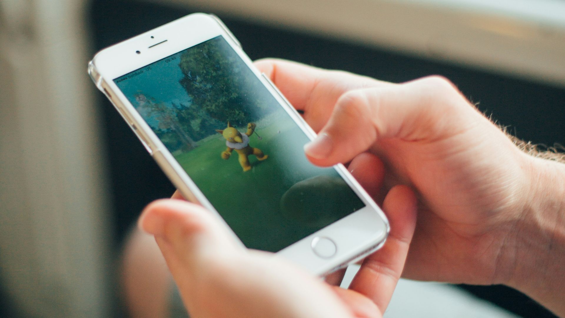 person holding white iphone 5