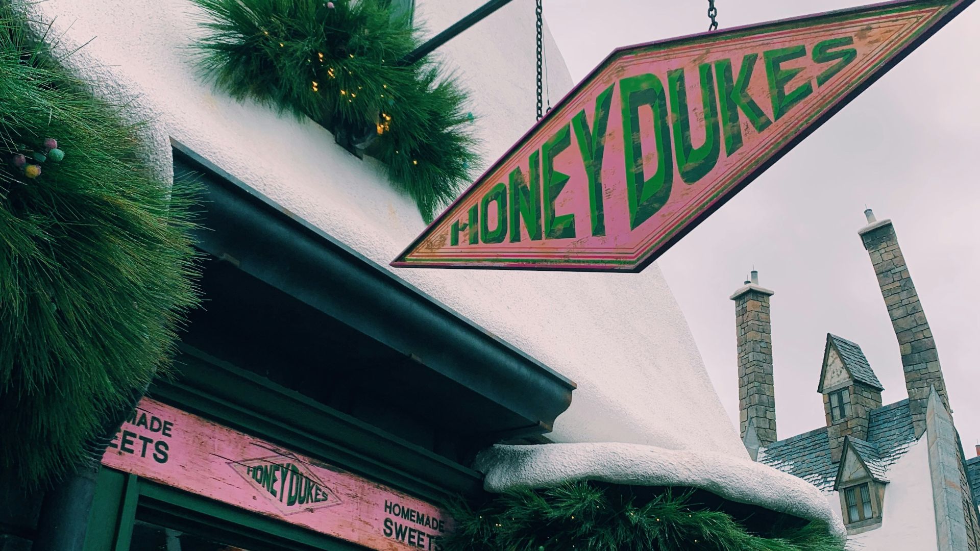 green tree near white concrete building