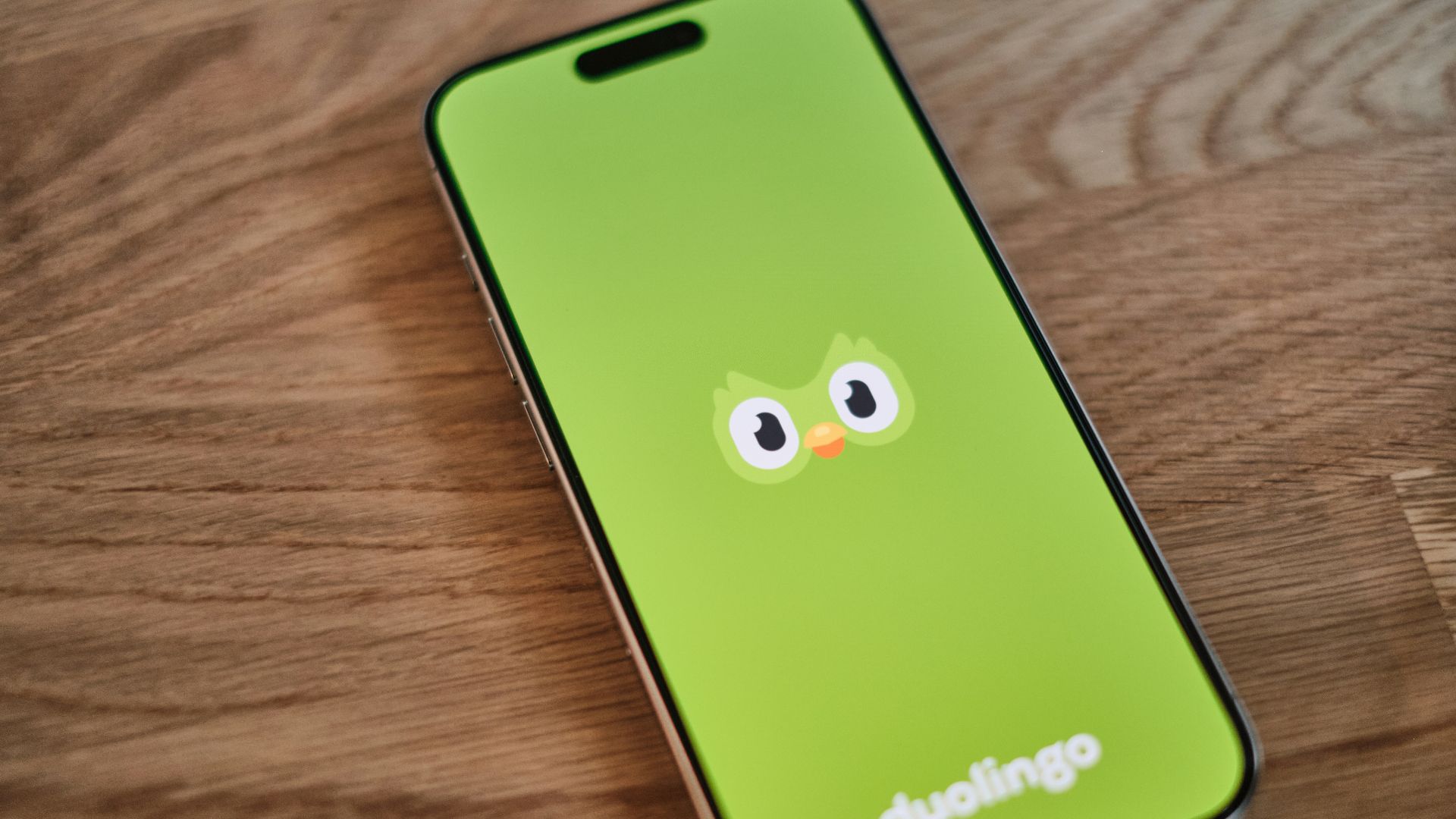 A green phone with a face drawn on it