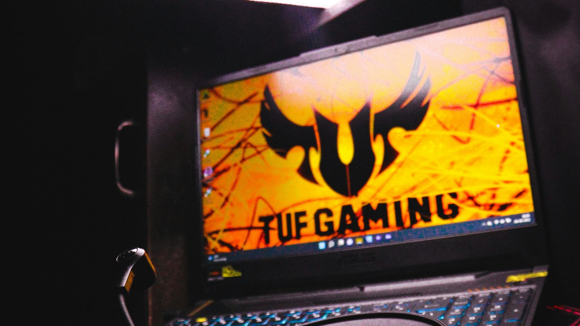 a laptop computer sitting on top of a desk