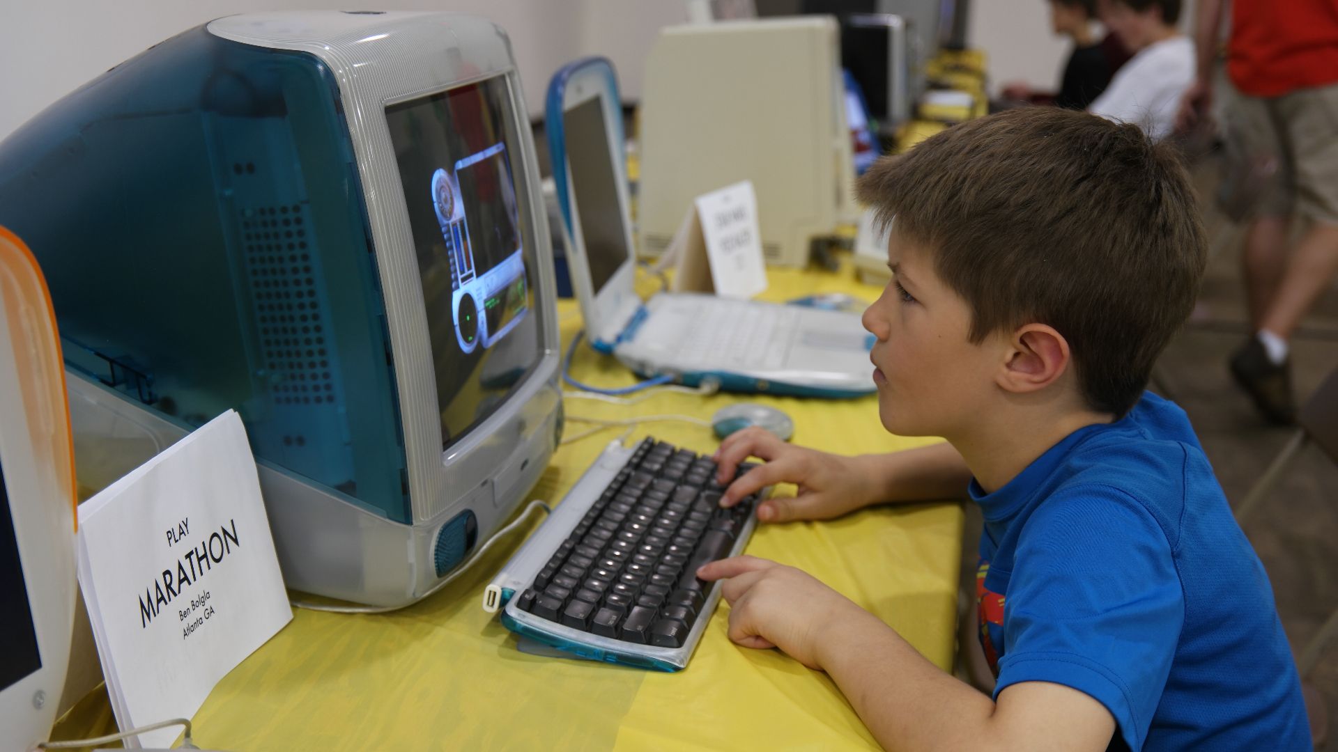 File:Kid playing on iMac (16728580353).jpg