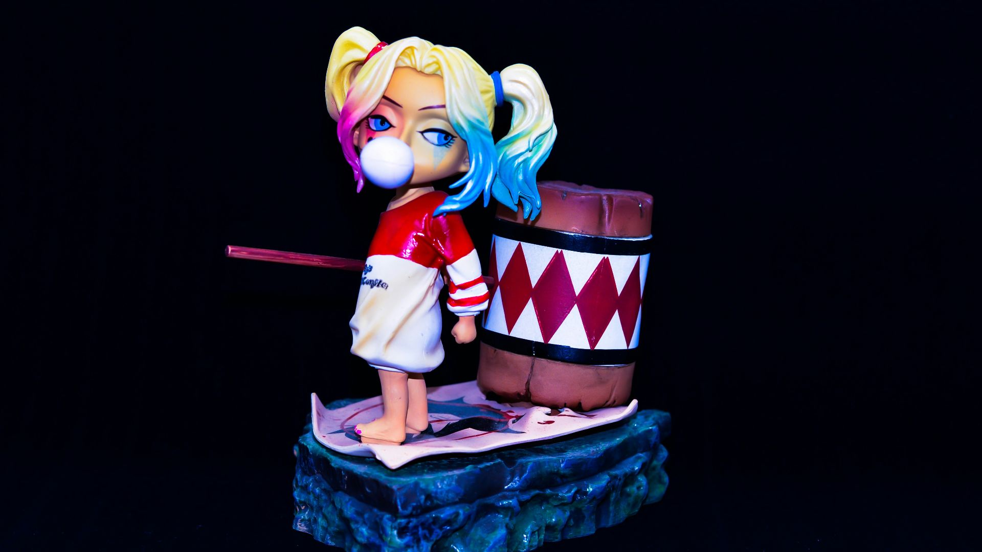 yellow haired girl in red and white dress holding red and white gift box
