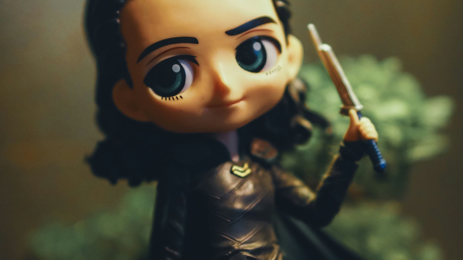 a close up of a figurine of a person holding a sword