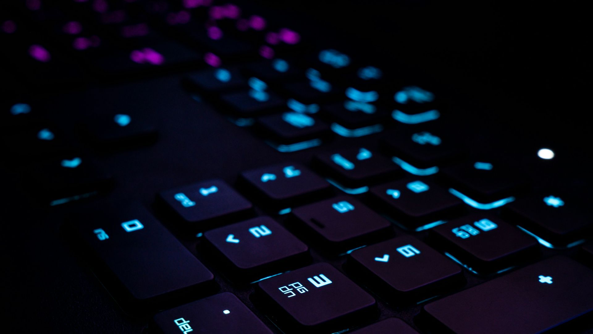 black computer keyboard on blue textile