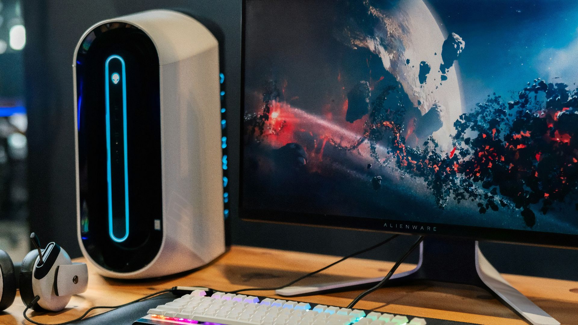 black flat screen computer monitor beside white computer keyboard