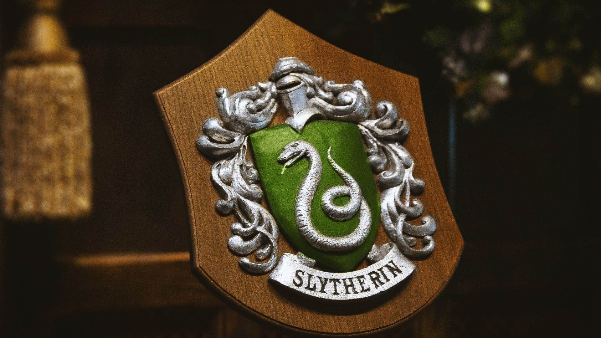 gold and green lion logo