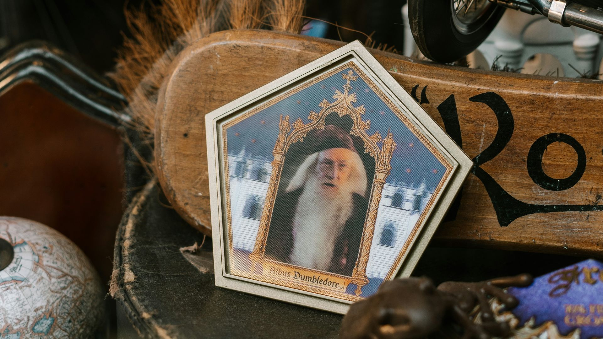 black and silver dumbbell beside brown wooden picture frame