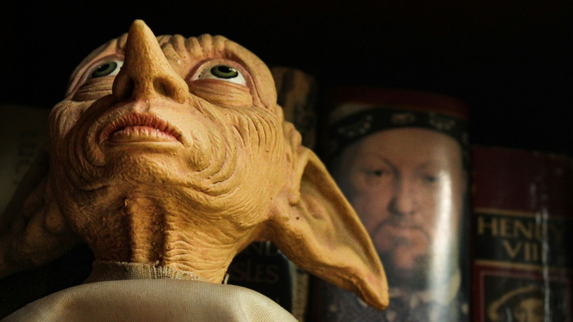 a close up of a statue of an old man