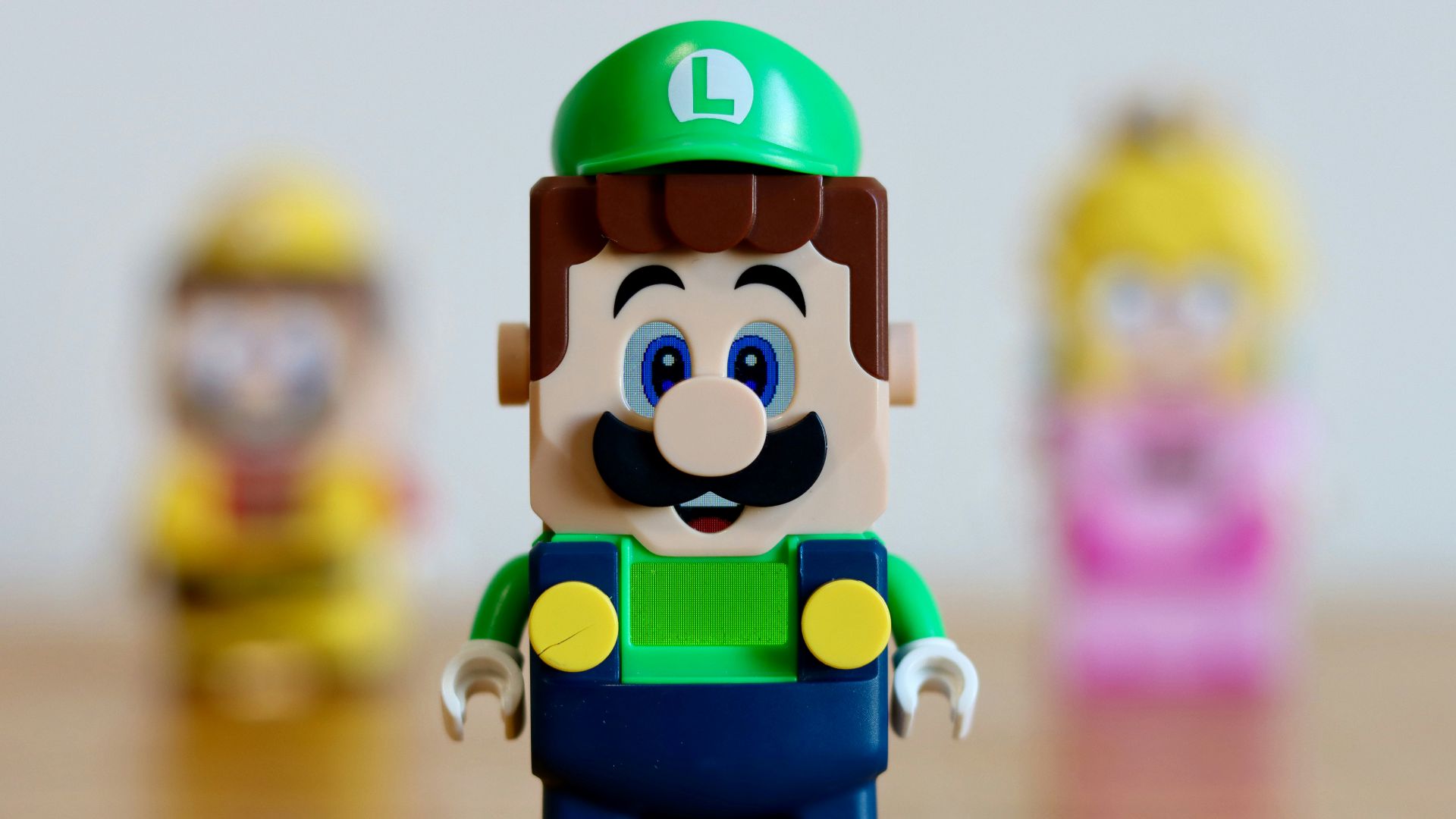 a toy figure of a man with a green hat