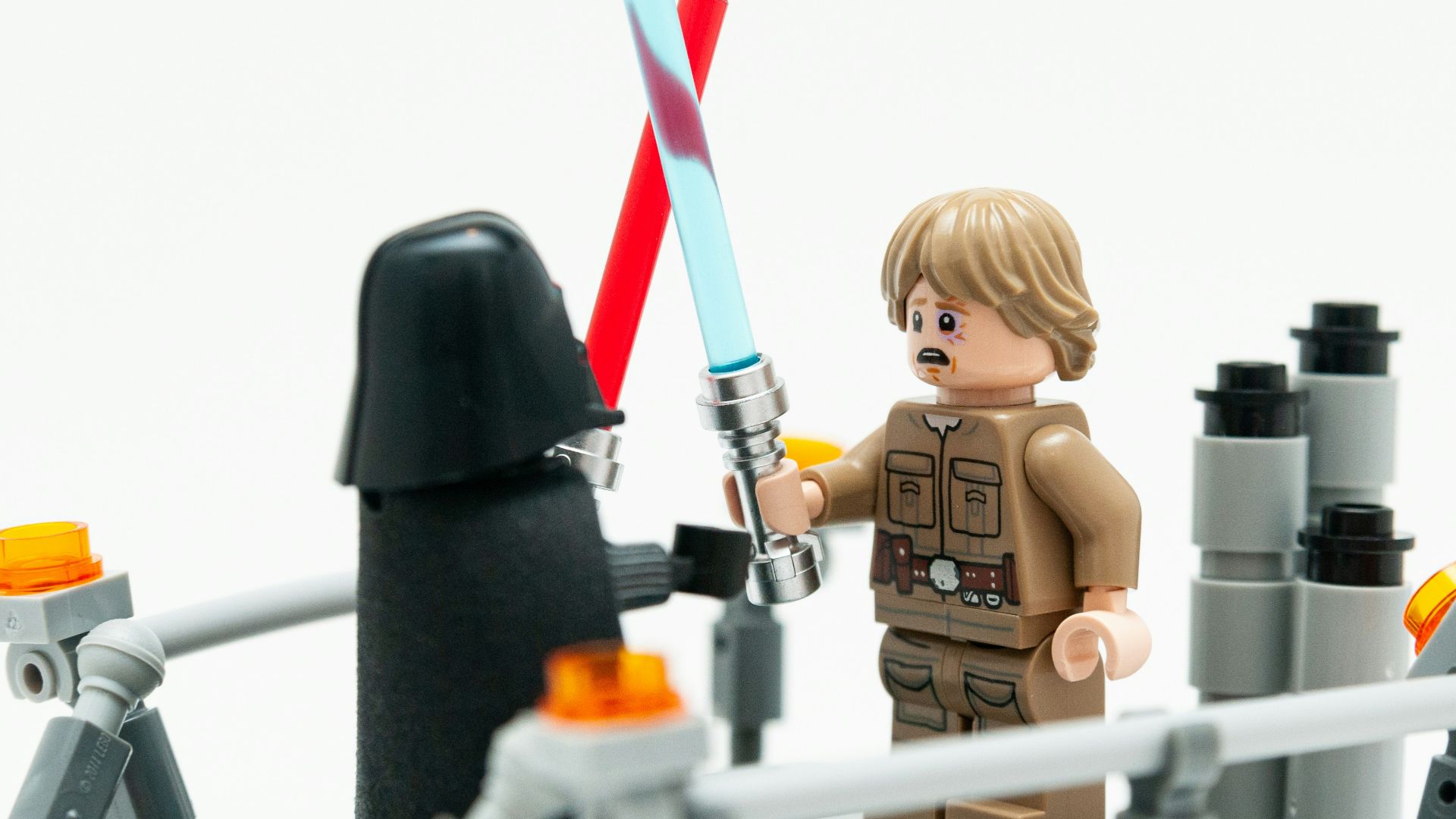 lego mini figure holding red and black sword